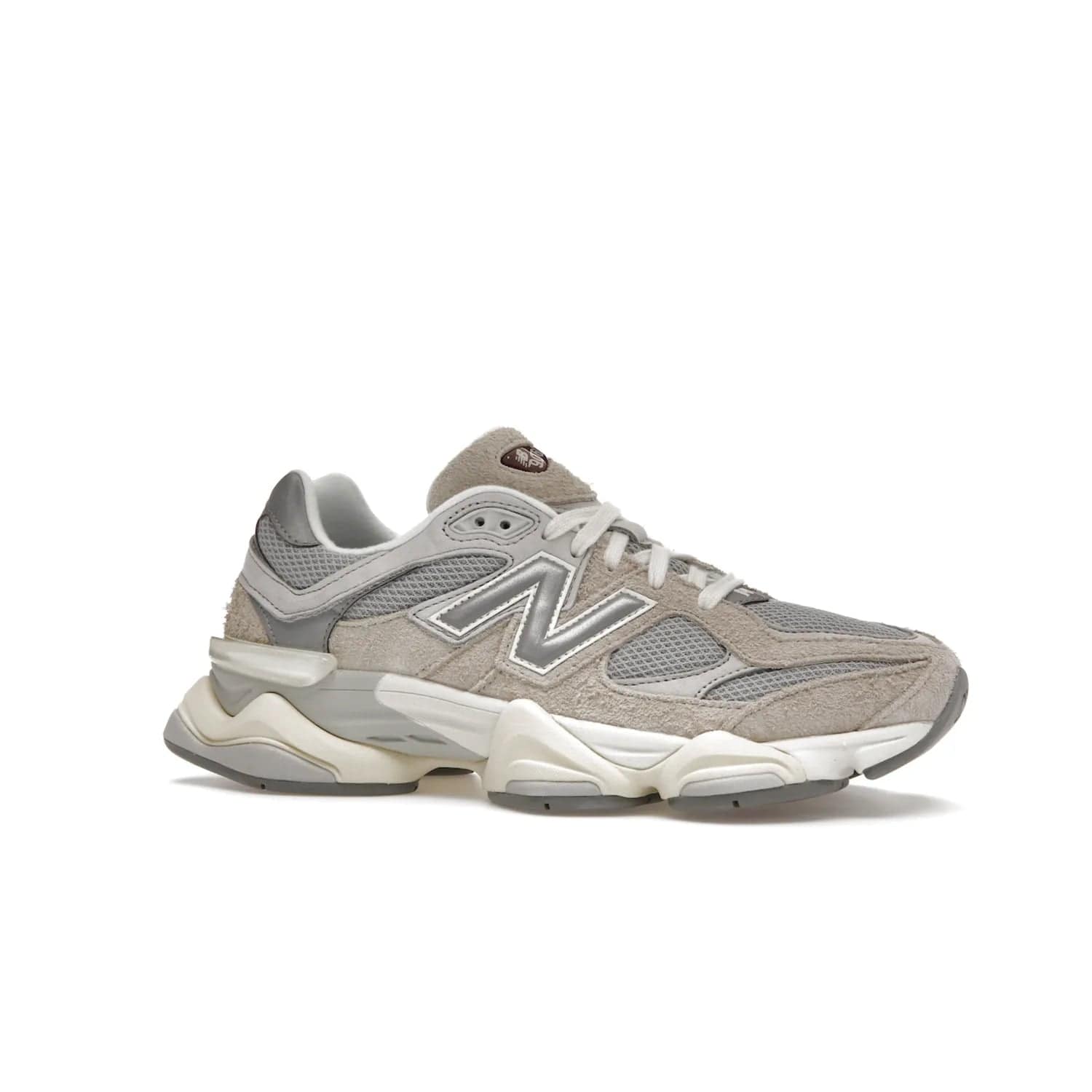 New Balance 9060 Lunar New Year Timberwolf Grey - Image 3 - Only at www.BallersClubKickz.com - This New Balance 9060 Lunar New Year Timberwolf Grey features a mesh upper and furry suede overlays in a stylish Timberwolf/Rain Cloud/Silver Metallic colorway. Its contemporary design includes ABZORB and SBS cushioning, a chunky rubber sole, and a lace-up front. Crafted to offer nothing but the best in style and comfort, the shoe released on 2nd January 2023.