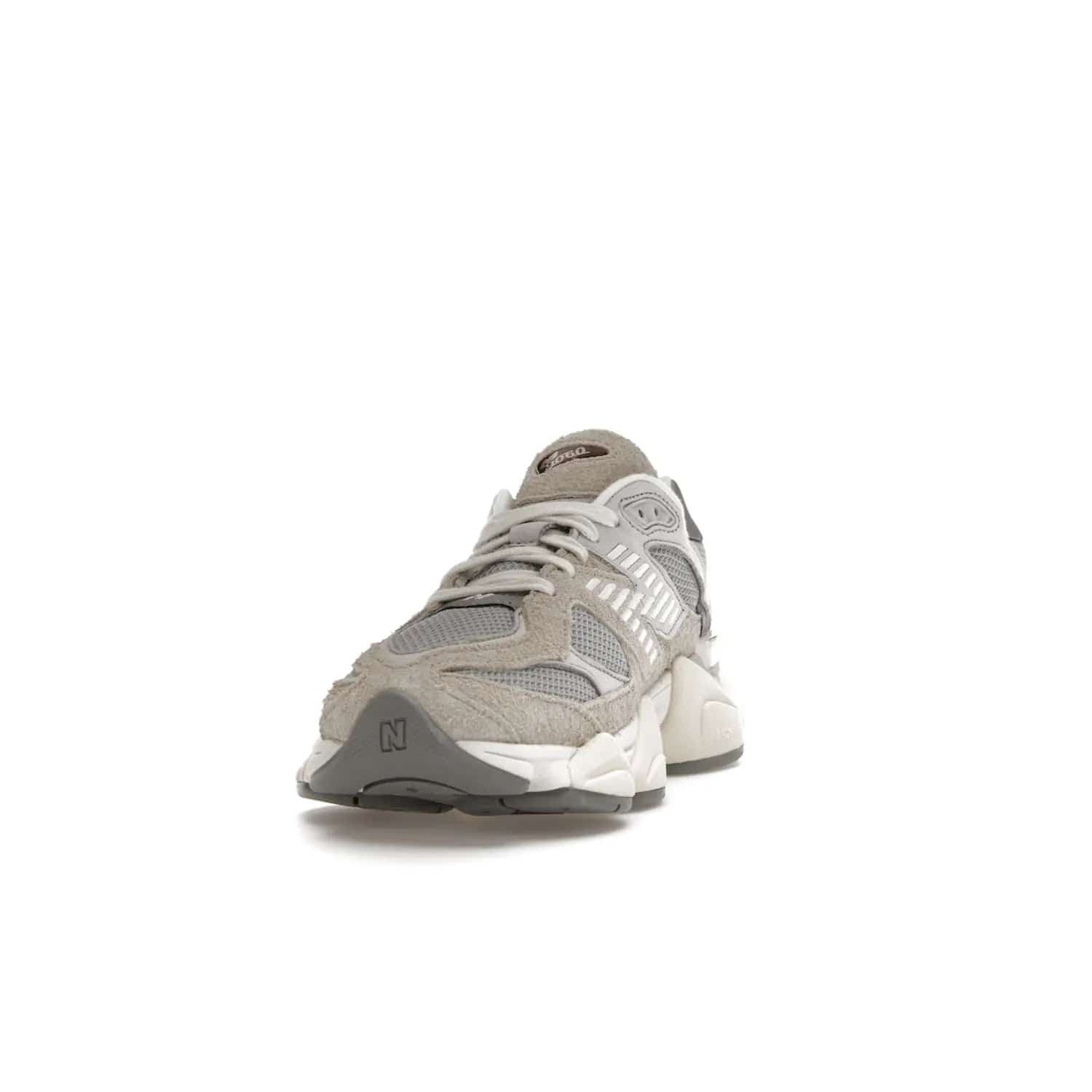 New Balance 9060 Lunar New Year Timberwolf Grey - Image 12 - Only at www.BallersClubKickz.com - This New Balance 9060 Lunar New Year Timberwolf Grey features a mesh upper and furry suede overlays in a stylish Timberwolf/Rain Cloud/Silver Metallic colorway. Its contemporary design includes ABZORB and SBS cushioning, a chunky rubber sole, and a lace-up front. Crafted to offer nothing but the best in style and comfort, the shoe released on 2nd January 2023.