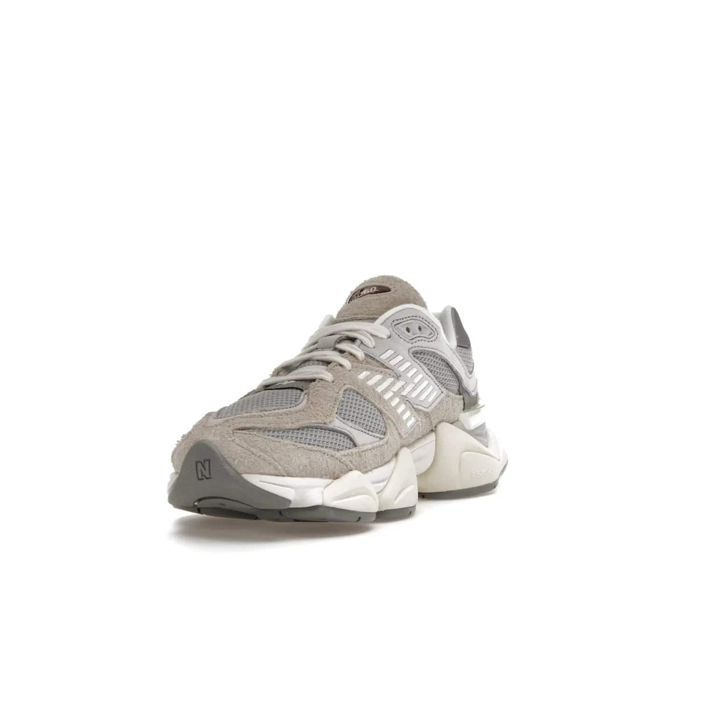 New Balance 9060 Lunar New Year Timberwolf Grey - Image 13 - Only at www.BallersClubKickz.com - This New Balance 9060 Lunar New Year Timberwolf Grey features a mesh upper and furry suede overlays in a stylish Timberwolf/Rain Cloud/Silver Metallic colorway. Its contemporary design includes ABZORB and SBS cushioning, a chunky rubber sole, and a lace-up front. Crafted to offer nothing but the best in style and comfort, the shoe released on 2nd January 2023.