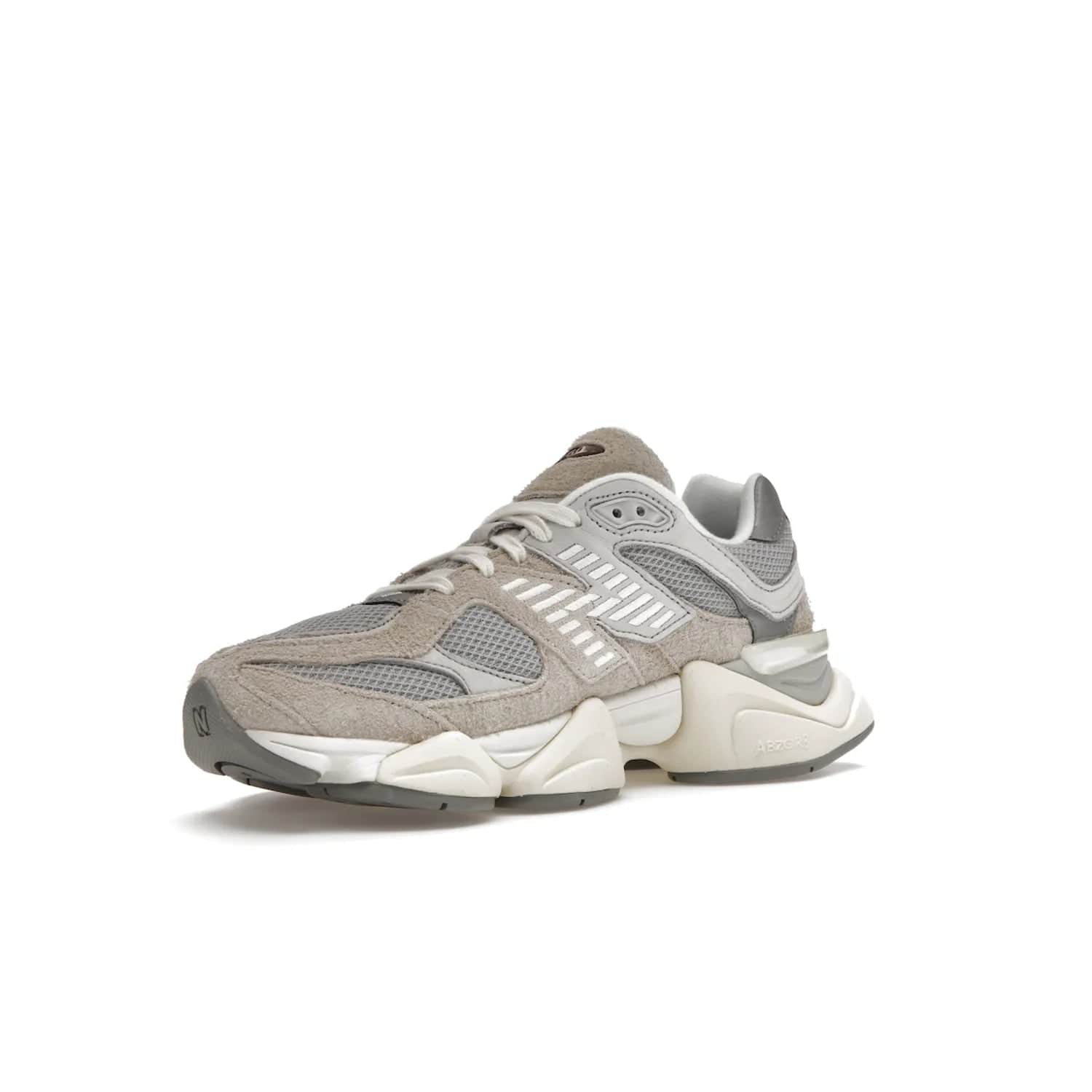 New Balance 9060 Lunar New Year Timberwolf Grey - Image 15 - Only at www.BallersClubKickz.com - This New Balance 9060 Lunar New Year Timberwolf Grey features a mesh upper and furry suede overlays in a stylish Timberwolf/Rain Cloud/Silver Metallic colorway. Its contemporary design includes ABZORB and SBS cushioning, a chunky rubber sole, and a lace-up front. Crafted to offer nothing but the best in style and comfort, the shoe released on 2nd January 2023.