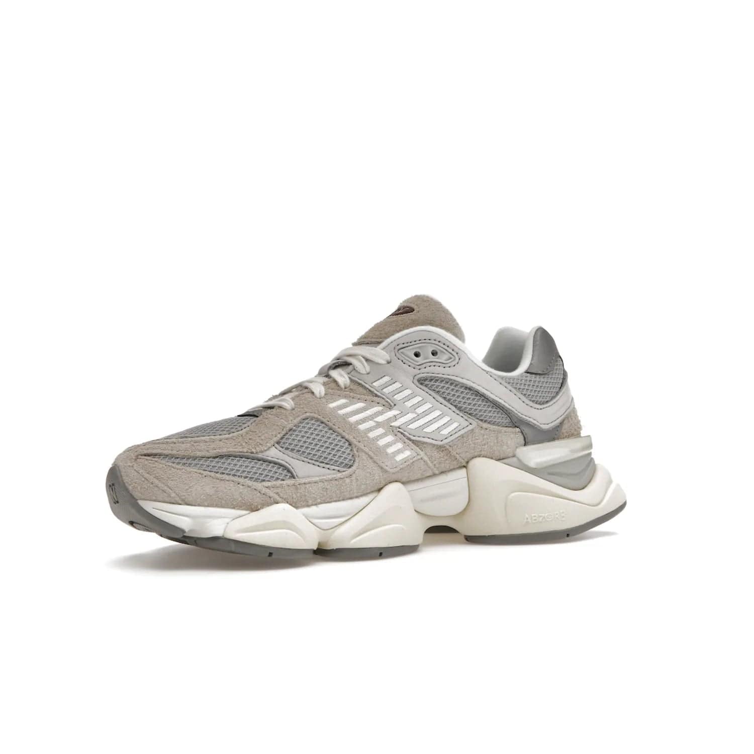 New Balance 9060 Lunar New Year Timberwolf Grey - Image 16 - Only at www.BallersClubKickz.com - This New Balance 9060 Lunar New Year Timberwolf Grey features a mesh upper and furry suede overlays in a stylish Timberwolf/Rain Cloud/Silver Metallic colorway. Its contemporary design includes ABZORB and SBS cushioning, a chunky rubber sole, and a lace-up front. Crafted to offer nothing but the best in style and comfort, the shoe released on 2nd January 2023.
