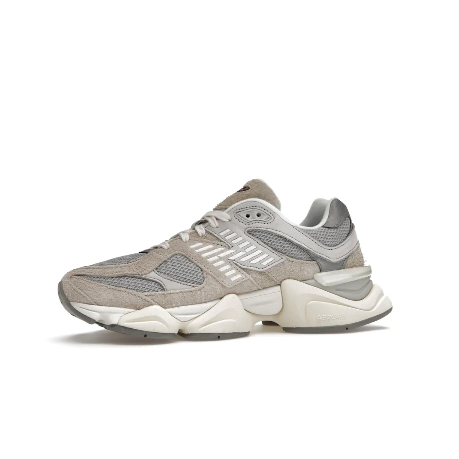 New Balance 9060 Lunar New Year Timberwolf Grey - Image 17 - Only at www.BallersClubKickz.com - This New Balance 9060 Lunar New Year Timberwolf Grey features a mesh upper and furry suede overlays in a stylish Timberwolf/Rain Cloud/Silver Metallic colorway. Its contemporary design includes ABZORB and SBS cushioning, a chunky rubber sole, and a lace-up front. Crafted to offer nothing but the best in style and comfort, the shoe released on 2nd January 2023.