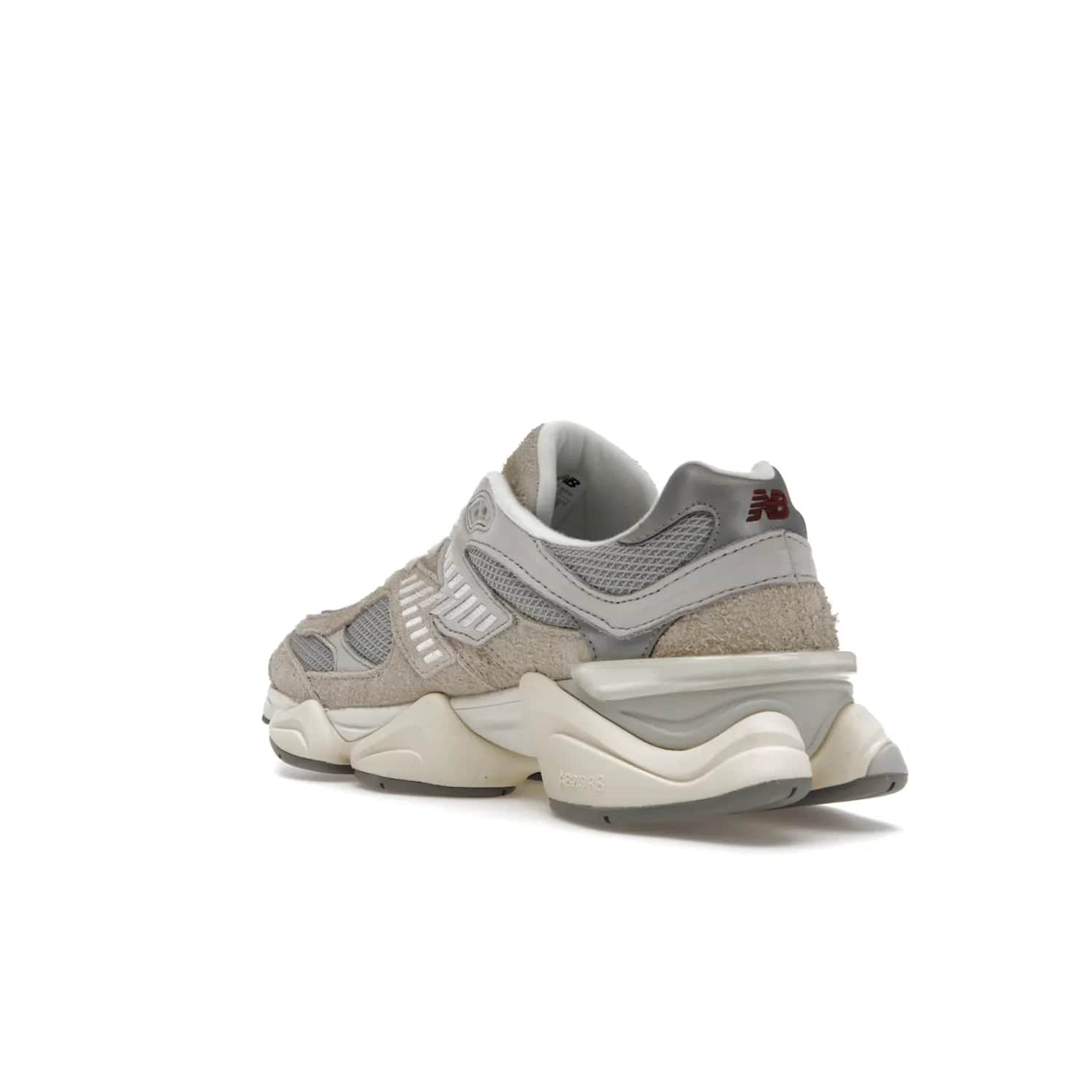 New Balance 9060 Lunar New Year Timberwolf Grey - Image 24 - Only at www.BallersClubKickz.com - This New Balance 9060 Lunar New Year Timberwolf Grey features a mesh upper and furry suede overlays in a stylish Timberwolf/Rain Cloud/Silver Metallic colorway. Its contemporary design includes ABZORB and SBS cushioning, a chunky rubber sole, and a lace-up front. Crafted to offer nothing but the best in style and comfort, the shoe released on 2nd January 2023.