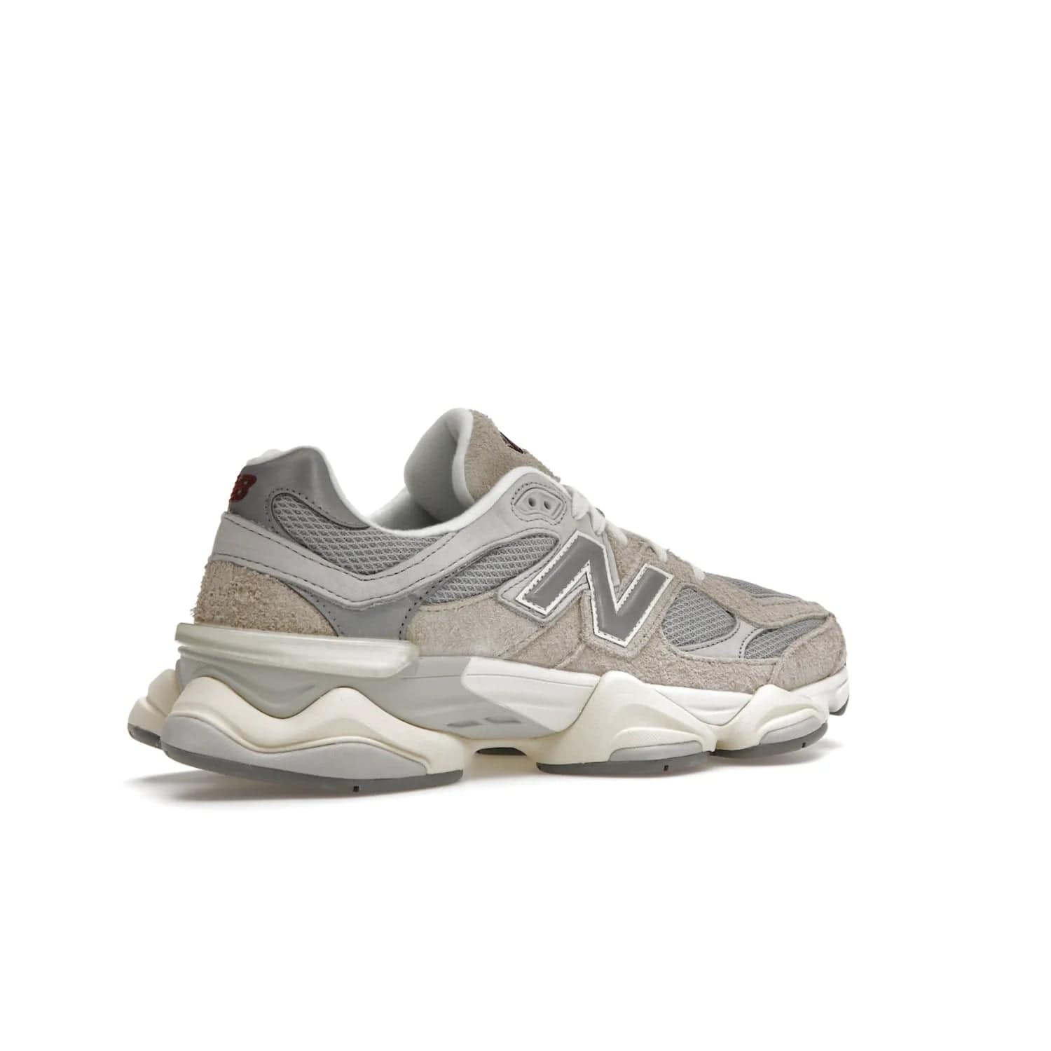 New Balance 9060 Lunar New Year Timberwolf Grey - Image 34 - Only at www.BallersClubKickz.com - This New Balance 9060 Lunar New Year Timberwolf Grey features a mesh upper and furry suede overlays in a stylish Timberwolf/Rain Cloud/Silver Metallic colorway. Its contemporary design includes ABZORB and SBS cushioning, a chunky rubber sole, and a lace-up front. Crafted to offer nothing but the best in style and comfort, the shoe released on 2nd January 2023.