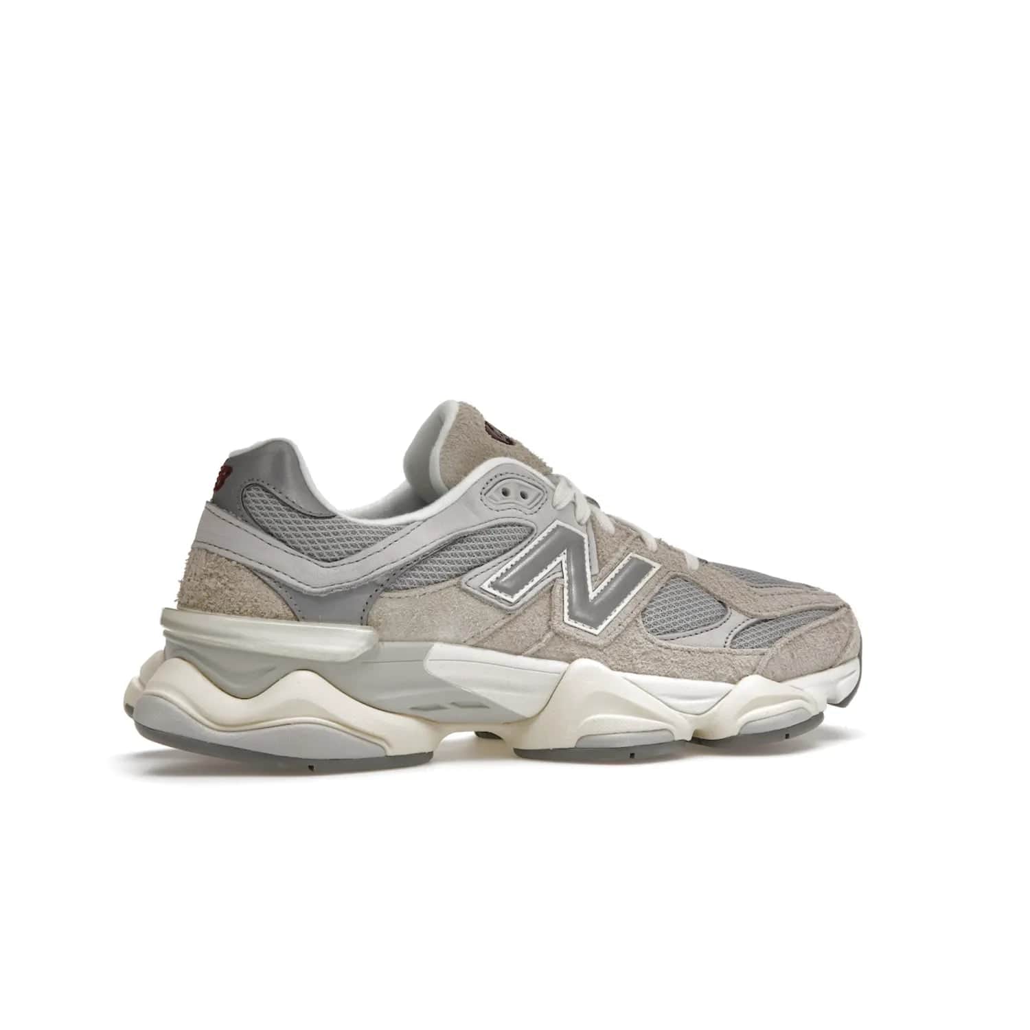 New Balance 9060 Lunar New Year Timberwolf Grey - Image 35 - Only at www.BallersClubKickz.com - This New Balance 9060 Lunar New Year Timberwolf Grey features a mesh upper and furry suede overlays in a stylish Timberwolf/Rain Cloud/Silver Metallic colorway. Its contemporary design includes ABZORB and SBS cushioning, a chunky rubber sole, and a lace-up front. Crafted to offer nothing but the best in style and comfort, the shoe released on 2nd January 2023.
