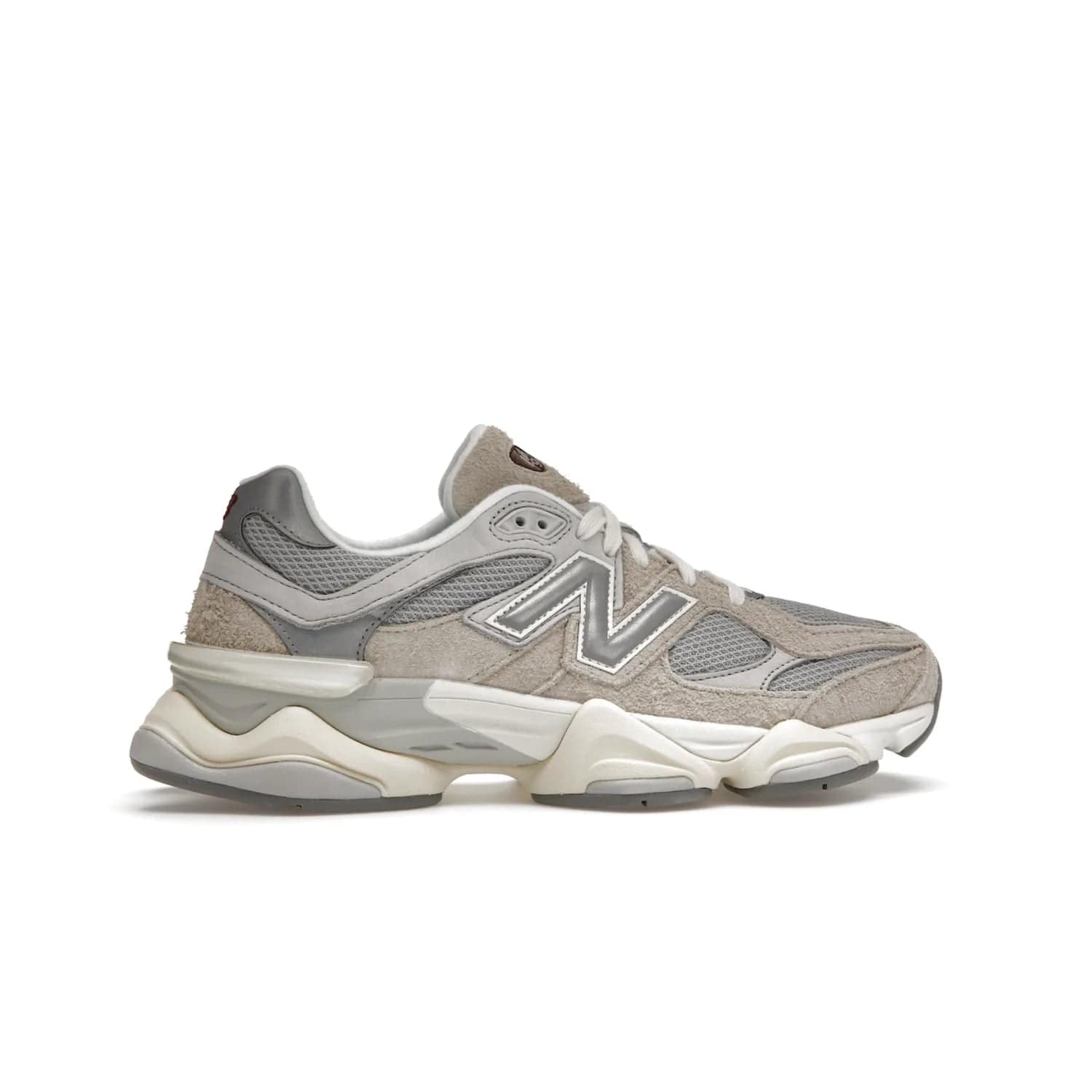 New Balance 9060 Lunar New Year Timberwolf Grey - Image 36 - Only at www.BallersClubKickz.com - This New Balance 9060 Lunar New Year Timberwolf Grey features a mesh upper and furry suede overlays in a stylish Timberwolf/Rain Cloud/Silver Metallic colorway. Its contemporary design includes ABZORB and SBS cushioning, a chunky rubber sole, and a lace-up front. Crafted to offer nothing but the best in style and comfort, the shoe released on 2nd January 2023.