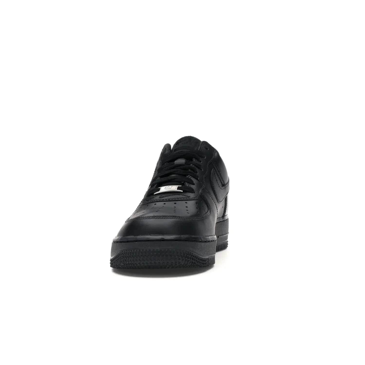 Nike Air Force 1 Low Supreme Black - Image 11 - Only at www.BallersClubKickz.com - Iconic style meets classic black design in the Nike Air Force 1 Low Supreme Black. Featuring a luxe leather upper and red Supreme Box Logo at the heel, these sneakers released in March 2020, and now available.