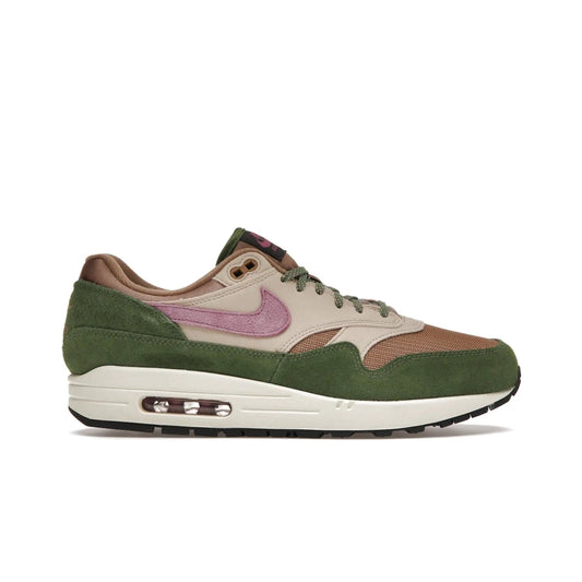 Nike Air Max 1 SH Treeline - Image 1 - Only at www.BallersClubKickz.com - A classic Nike Air Max 1 SH Treeline with a brown mesh upper, taupe Durabuck overlays, and hairy green suede details. Light Bordeaux Swoosh and woven tongue label for a pop of color. Released in May 2022. Perfect for any outfit and sure to impress.