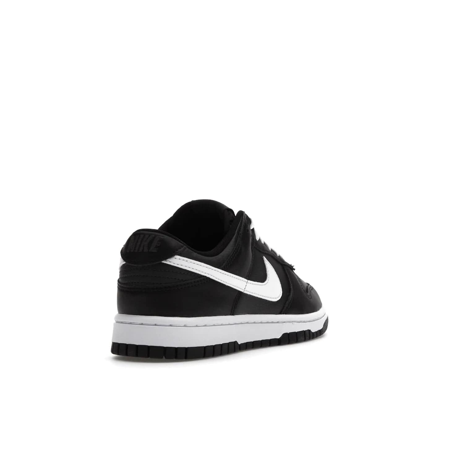Nike Dunk Low Black White (2022) - Image 31 - Only at www.BallersClubKickz.com - A classic Nike Dunk Low in black and white. Its tumbled leather upper features leather overlays and white Nike Swooshes. The design also includes a woven tongue label and an EVA foam sole for cushioning and support. An effortlessly stylish and timeless look. The Nike Dunk Low Black White (2022) released in May. Step out in style.
