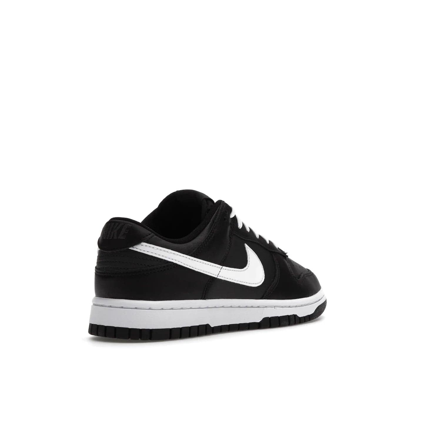 Nike Dunk Low Black White (2022) - Image 32 - Only at www.BallersClubKickz.com - A classic Nike Dunk Low in black and white. Its tumbled leather upper features leather overlays and white Nike Swooshes. The design also includes a woven tongue label and an EVA foam sole for cushioning and support. An effortlessly stylish and timeless look. The Nike Dunk Low Black White (2022) released in May. Step out in style.
