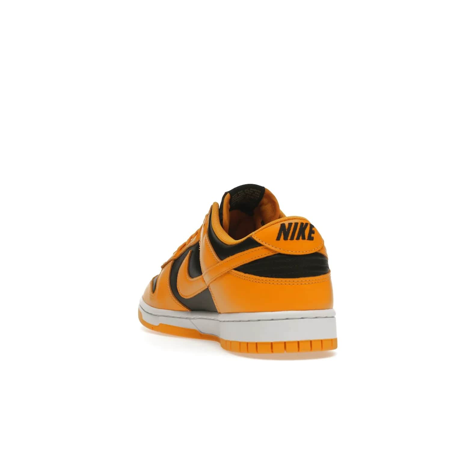 Nike Dunk Low Championship Goldenrod (2021) - Image 26 - Only at www.BallersClubKickz.com - Iconic silhouette Nike Dunk Low is back with a luxe look. Featuring a black upper, goldenrod overlays, and white and yellow Nike Air sole, this retro inspired design is perfect for the sneaker culture enthusiast. Releasing in December 2021 at $100.