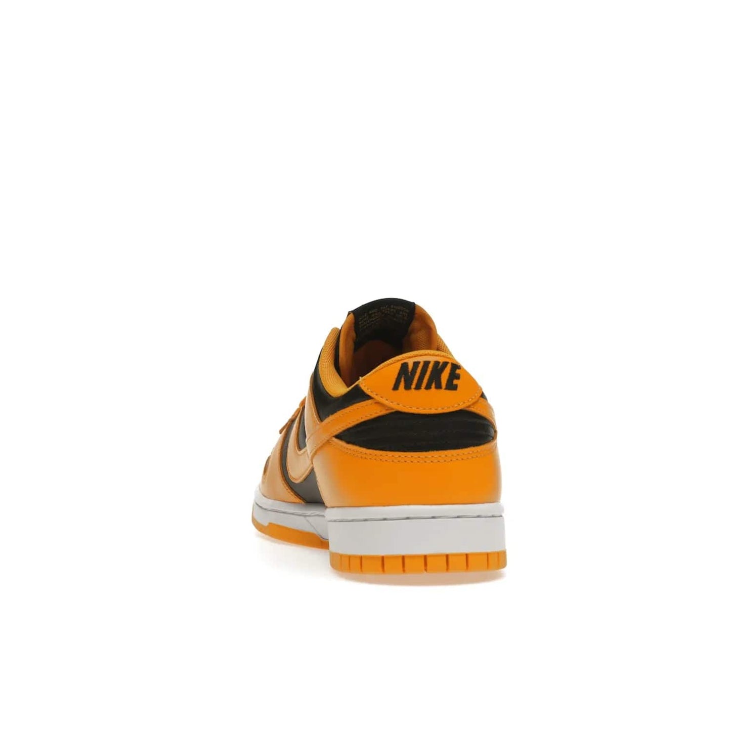 Nike Dunk Low Championship Goldenrod (2021) - Image 27 - Only at www.BallersClubKickz.com - Iconic silhouette Nike Dunk Low is back with a luxe look. Featuring a black upper, goldenrod overlays, and white and yellow Nike Air sole, this retro inspired design is perfect for the sneaker culture enthusiast. Releasing in December 2021 at $100.