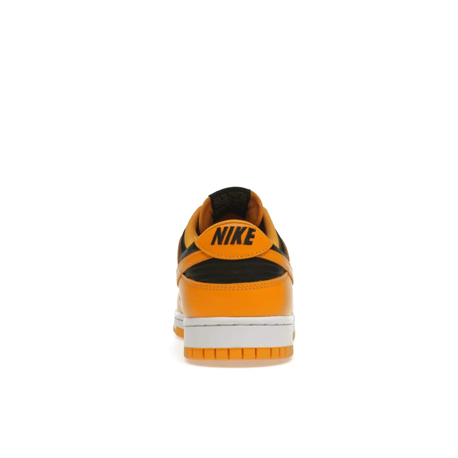 Nike Dunk Low Championship Goldenrod (2021) - Image 28 - Only at www.BallersClubKickz.com - Iconic silhouette Nike Dunk Low is back with a luxe look. Featuring a black upper, goldenrod overlays, and white and yellow Nike Air sole, this retro inspired design is perfect for the sneaker culture enthusiast. Releasing in December 2021 at $100.