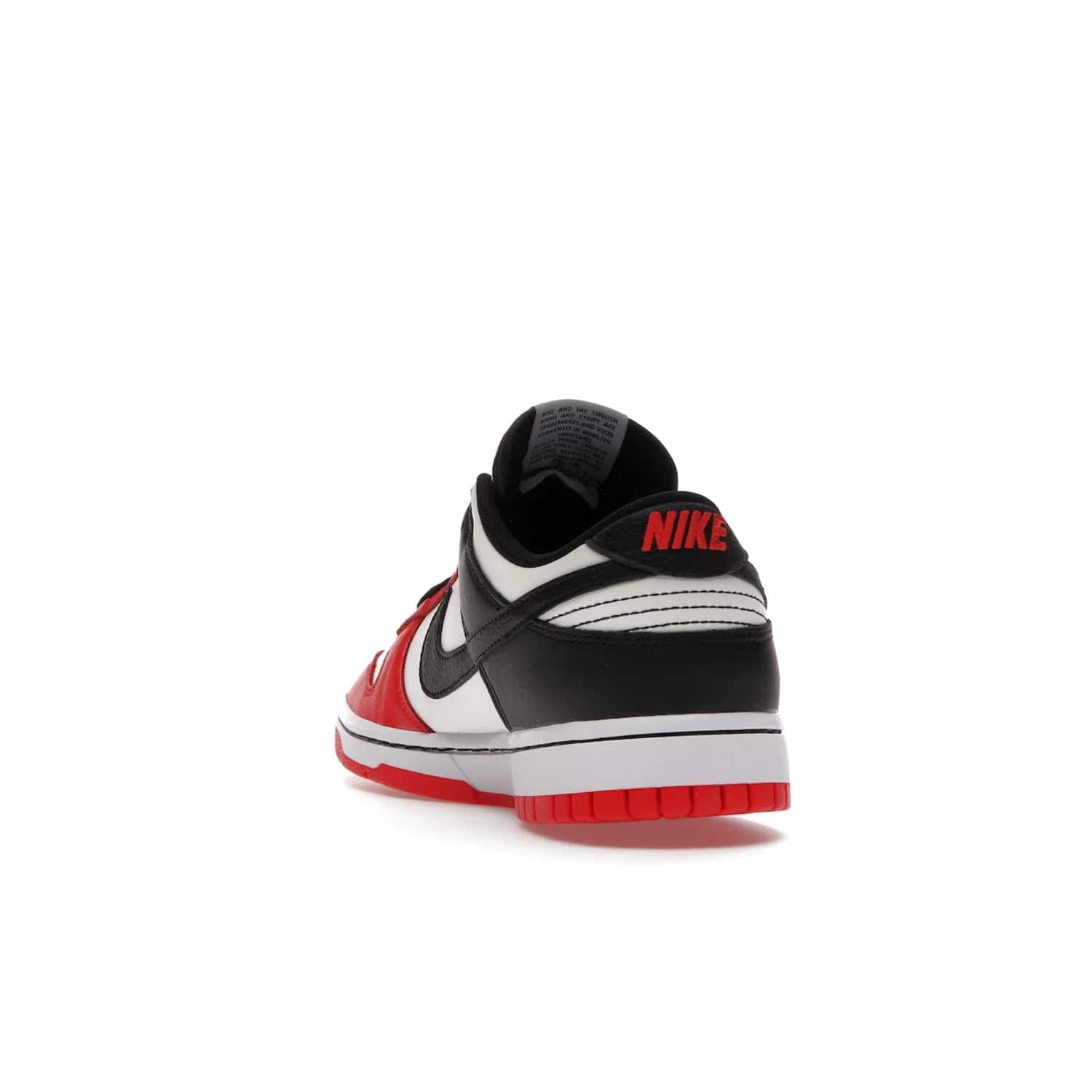 Nike Dunk Low EMB NBA 75th Anniversary Chicago - Image 26 - Only at www.BallersClubKickz.com - The Nike Dunk Low EMB celebrates the NBA's 75th Anniversary with a sleek Sail Leather upper, black overlays and vibrant red accent tones. Finished off with an NBA logo woven tongue tag and a black sole for a monochrome look.