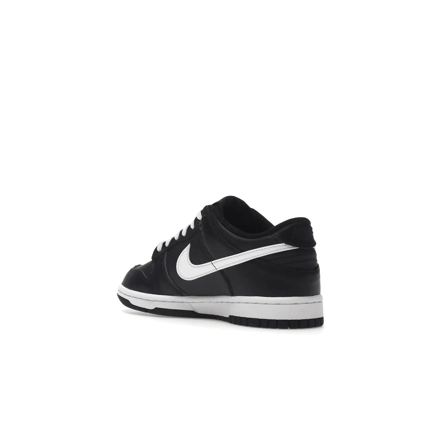 Nike Dunk Low Black White (2022) (GS) - Image 24 - Only at www.BallersClubKickz.com - A classic two-tone upper of black & off white, low profile midsole, and patterned rubber outsole make the Nike Dunk Low Black White 2022 GS perfect for any style. Get the complete look and release date on July 12, 2022.