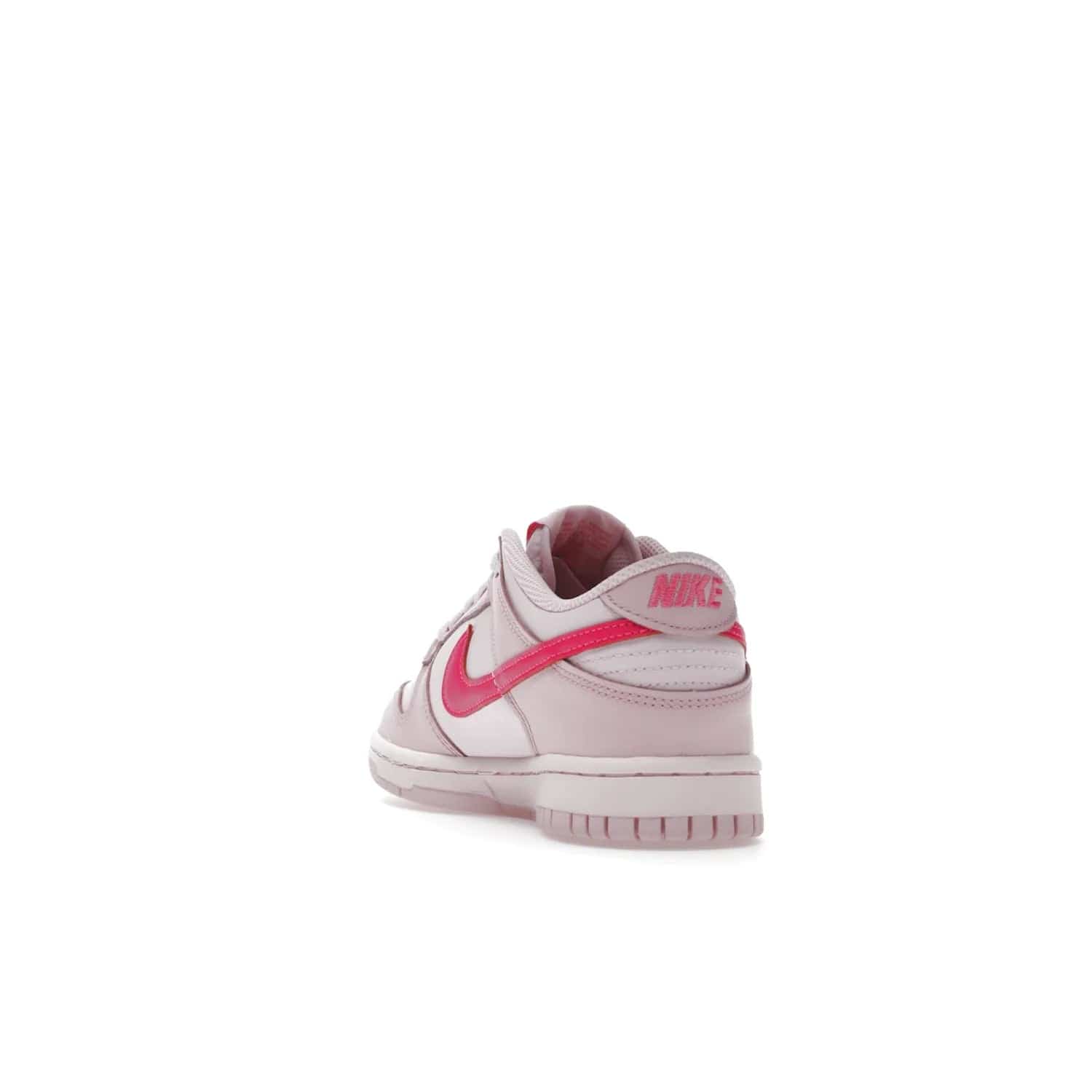 Nike Dunk Low Triple Pink (GS) - Image 26 - Only at www.BallersClubKickz.com - The Nike Dunk Low Triple Pink provides bold style in GS sizing. Featuring 3 distinct shades of pink and Nike branding, the shoe stands out.