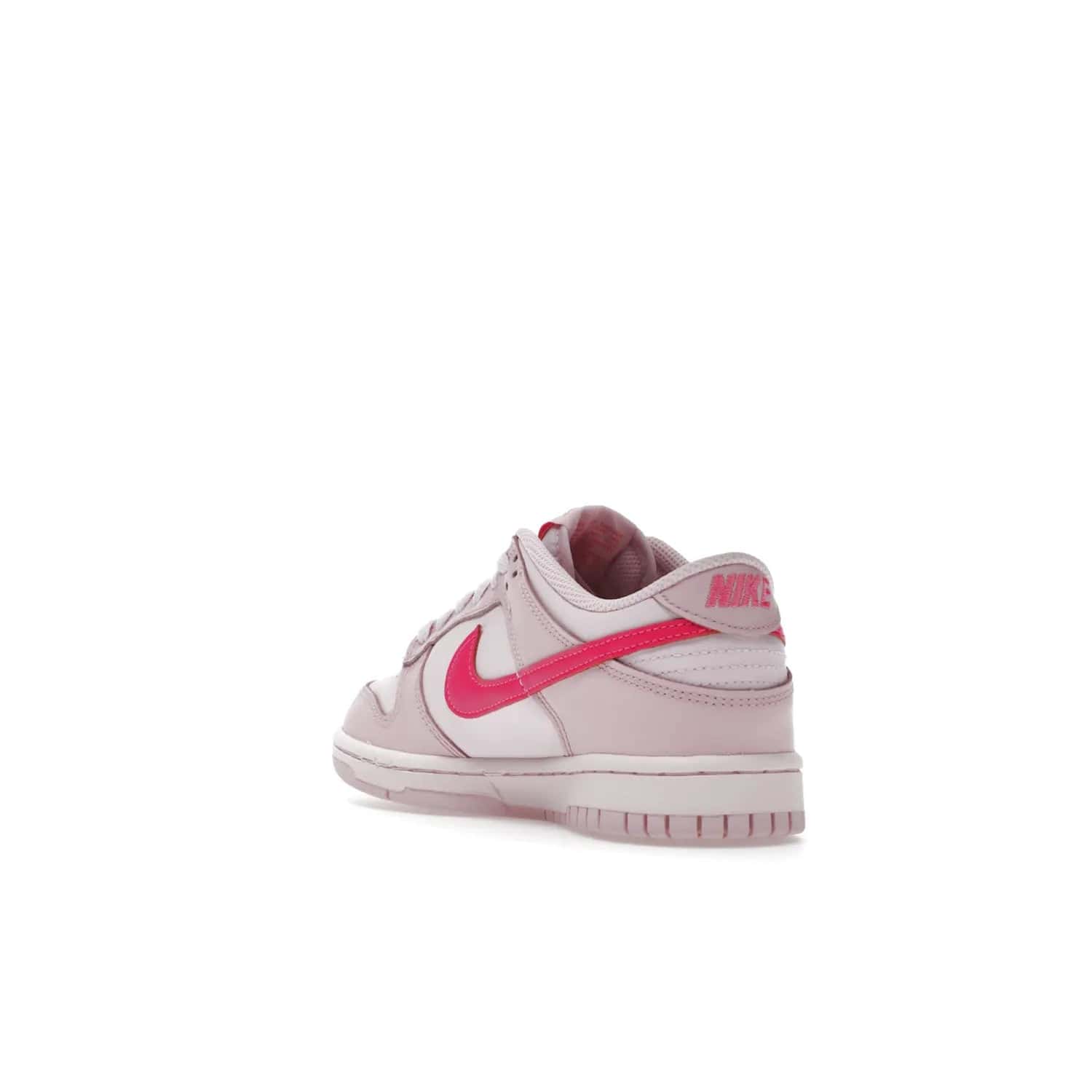 Nike Dunk Low Triple Pink (GS) - Image 25 - Only at www.BallersClubKickz.com - The Nike Dunk Low Triple Pink provides bold style in GS sizing. Featuring 3 distinct shades of pink and Nike branding, the shoe stands out.