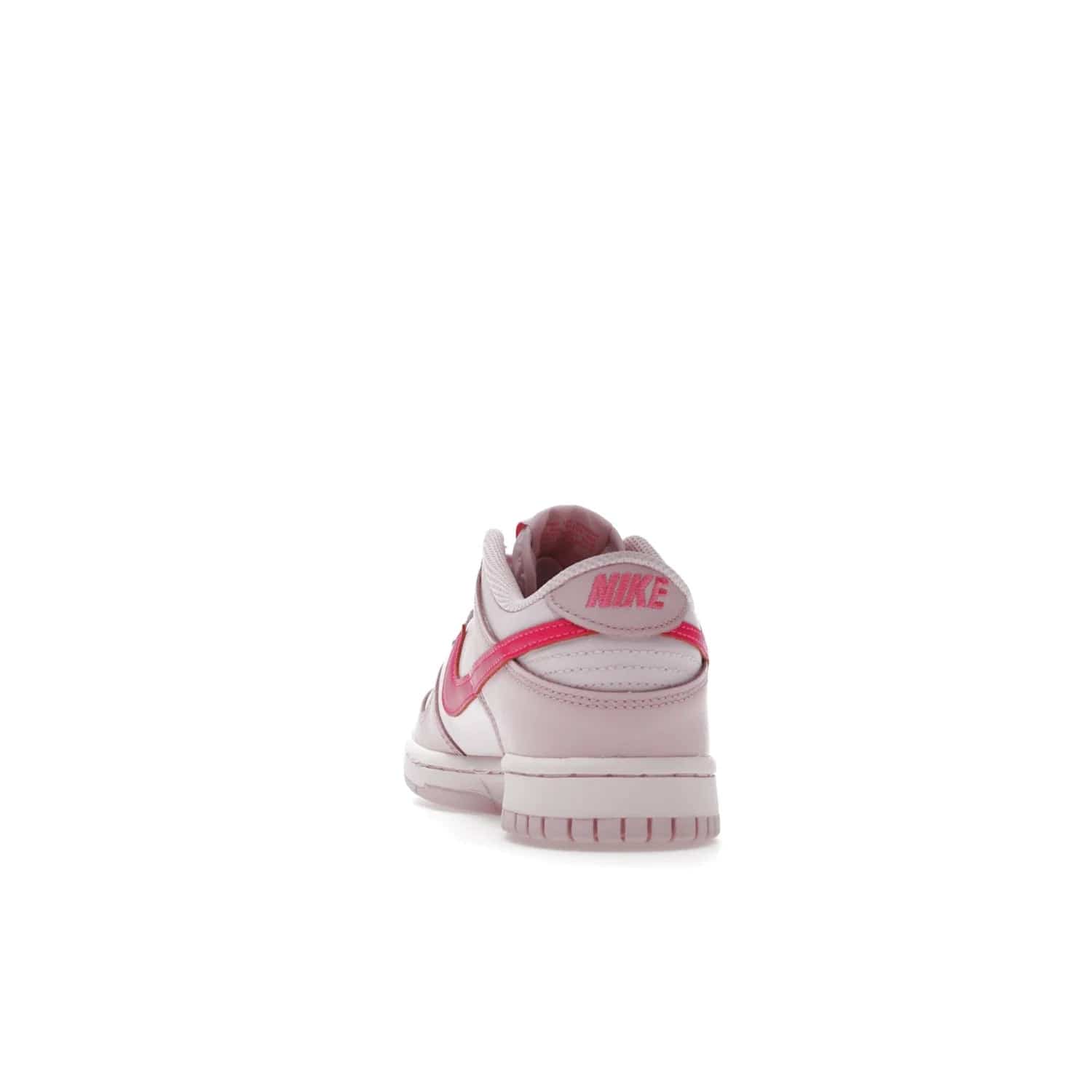 Nike Dunk Low Triple Pink (GS) - Image 27 - Only at www.BallersClubKickz.com - The Nike Dunk Low Triple Pink provides bold style in GS sizing. Featuring 3 distinct shades of pink and Nike branding, the shoe stands out.