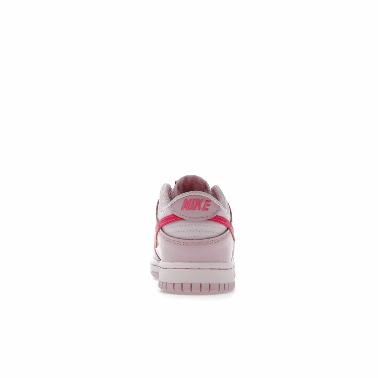 Nike Dunk Low Triple Pink (GS) - Image 28 - Only at www.BallersClubKickz.com - The Nike Dunk Low Triple Pink provides bold style in GS sizing. Featuring 3 distinct shades of pink and Nike branding, the shoe stands out.