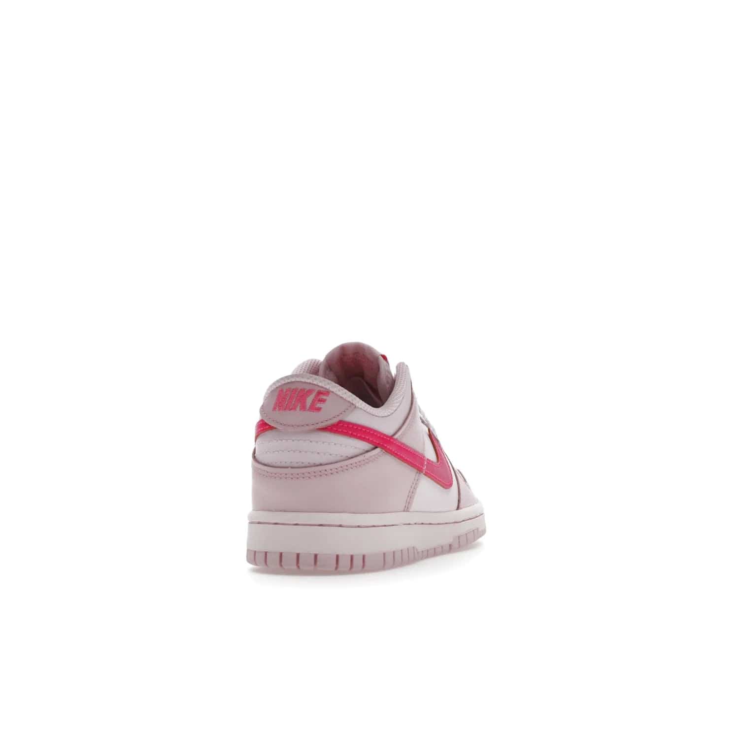 Nike Dunk Low Triple Pink (GS) - Image 30 - Only at www.BallersClubKickz.com - The Nike Dunk Low Triple Pink provides bold style in GS sizing. Featuring 3 distinct shades of pink and Nike branding, the shoe stands out.