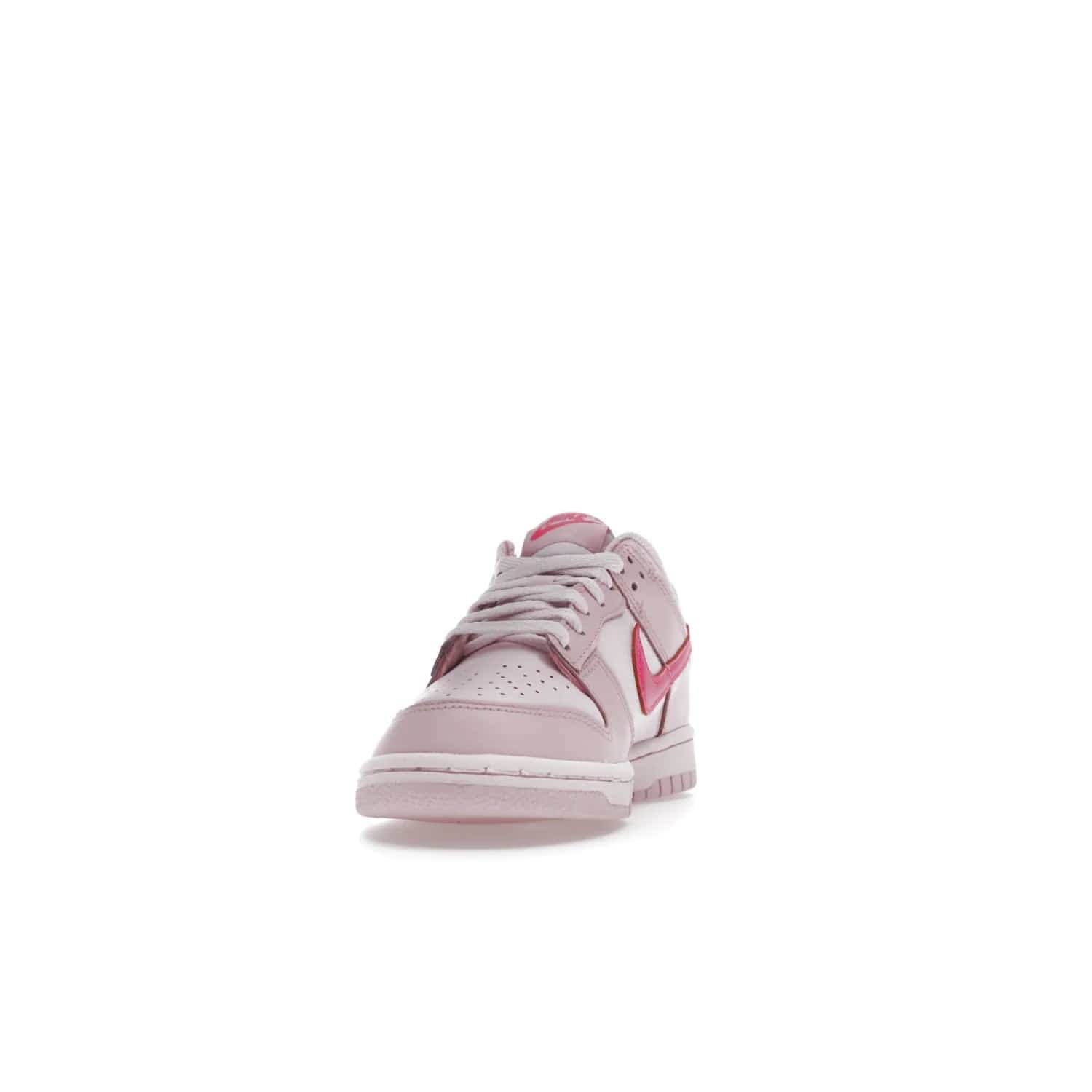 Nike Dunk Low Triple Pink (GS) - Image 12 - Only at www.BallersClubKickz.com - The Nike Dunk Low Triple Pink provides bold style in GS sizing. Featuring 3 distinct shades of pink and Nike branding, the shoe stands out.