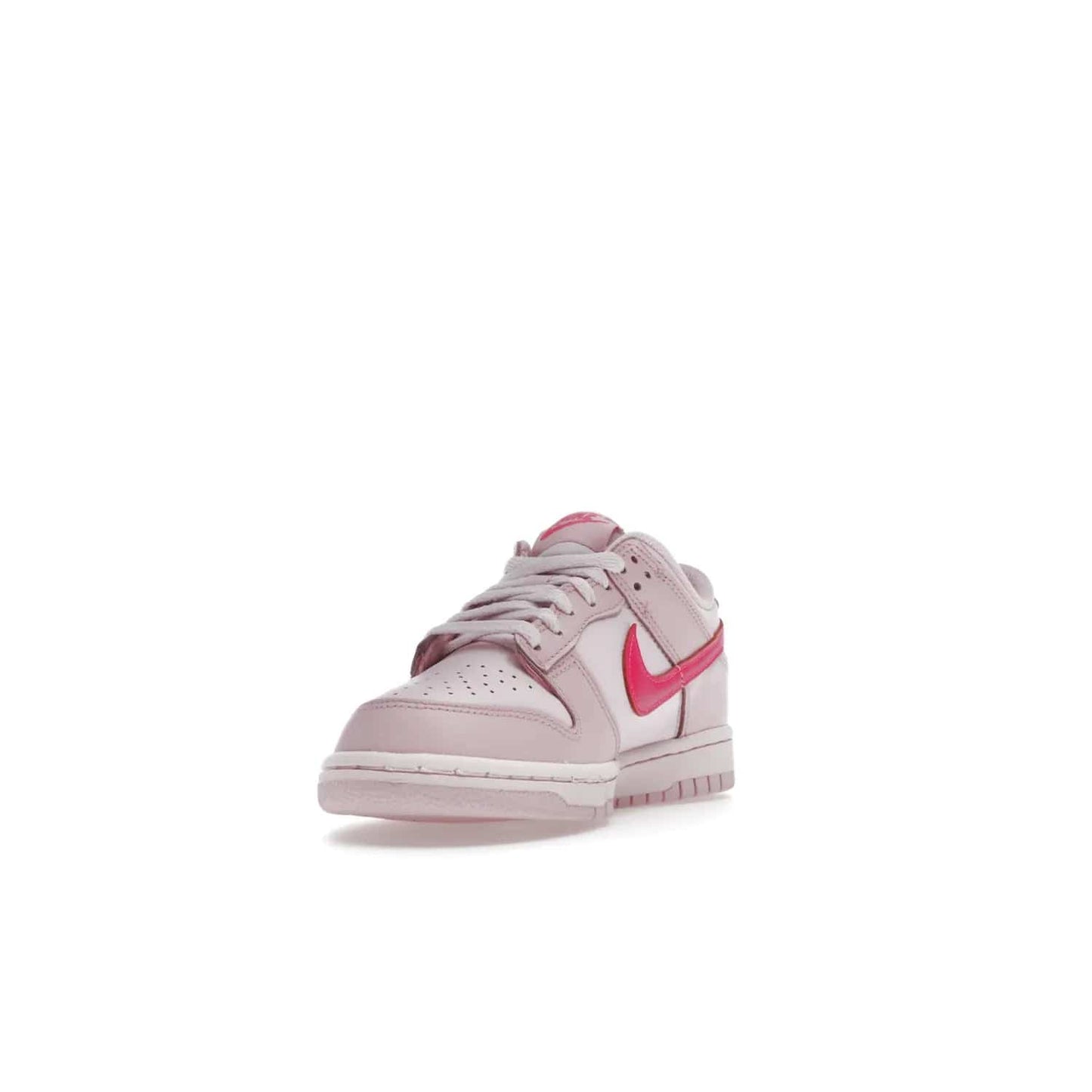 Nike Dunk Low Triple Pink (GS) - Image 13 - Only at www.BallersClubKickz.com - The Nike Dunk Low Triple Pink provides bold style in GS sizing. Featuring 3 distinct shades of pink and Nike branding, the shoe stands out.