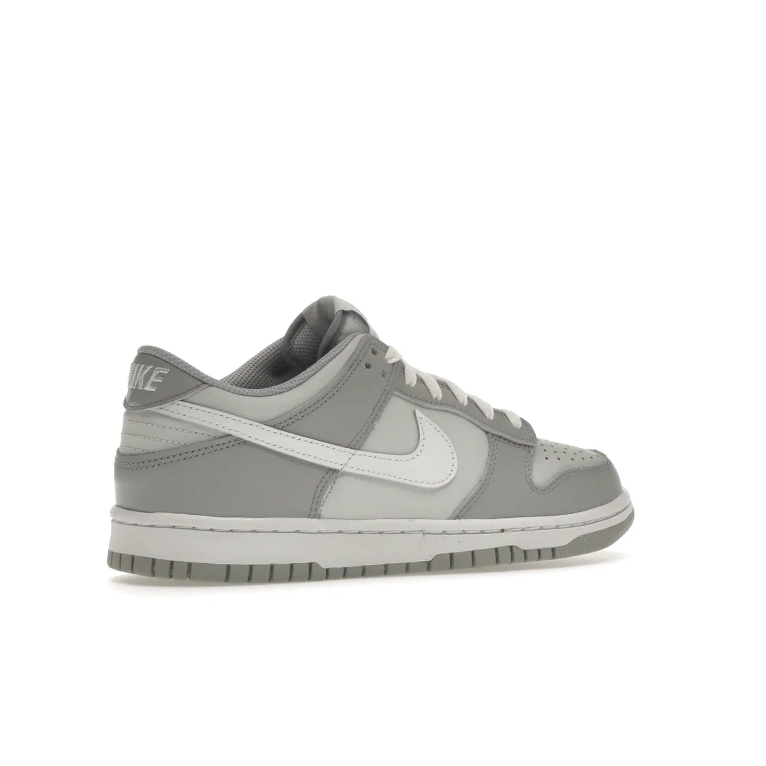 Nike Dunk Low Two-Toned Grey (GS) - Image 34 - Only at www.BallersClubKickz.com - Stylish Nike Dunk Low GS Two-Toned Grey featuring leather build, light/dark grey shades, white Swoosh logo & gray rubber outsole. Get ready to make a statement with this timeless classic released in March 2022.