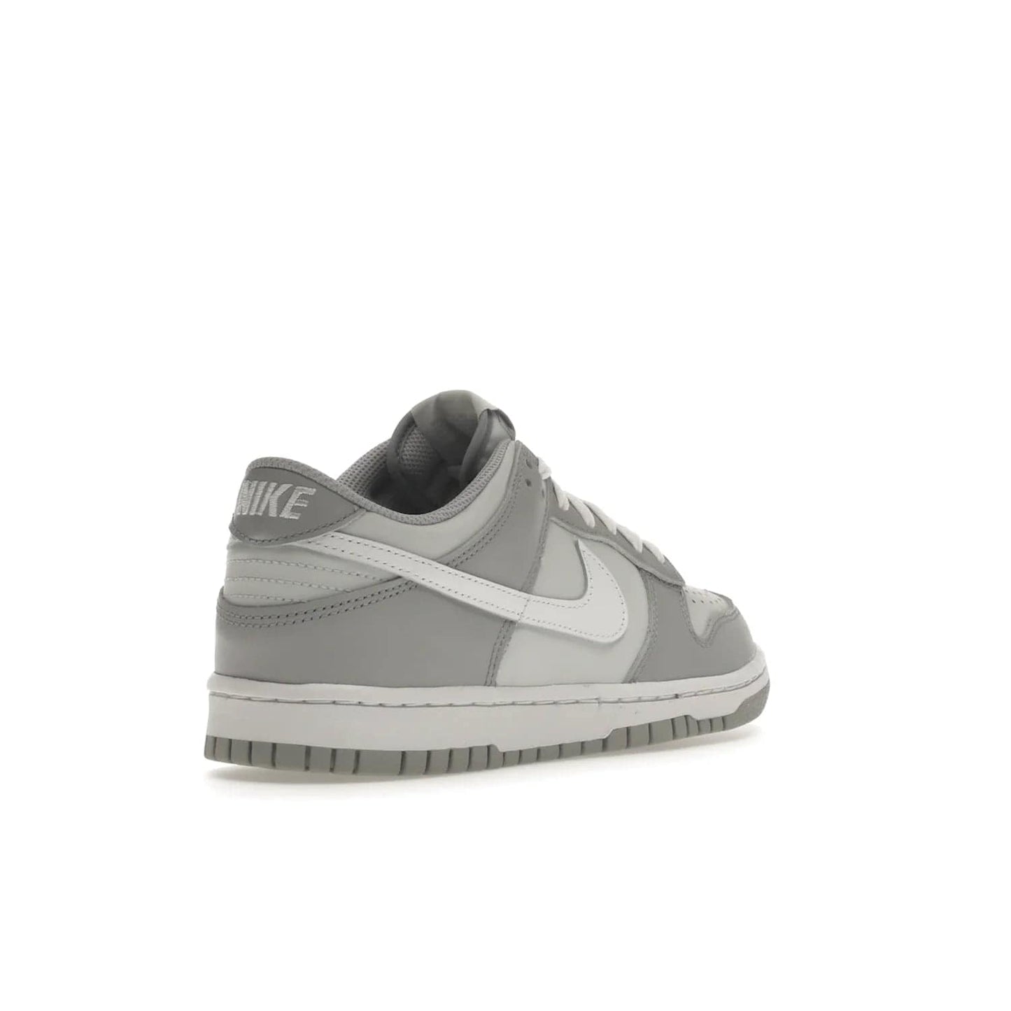Nike Dunk Low Two-Toned Grey (GS) - Image 32 - Only at www.BallersClubKickz.com - Stylish Nike Dunk Low GS Two-Toned Grey featuring leather build, light/dark grey shades, white Swoosh logo & gray rubber outsole. Get ready to make a statement with this timeless classic released in March 2022.