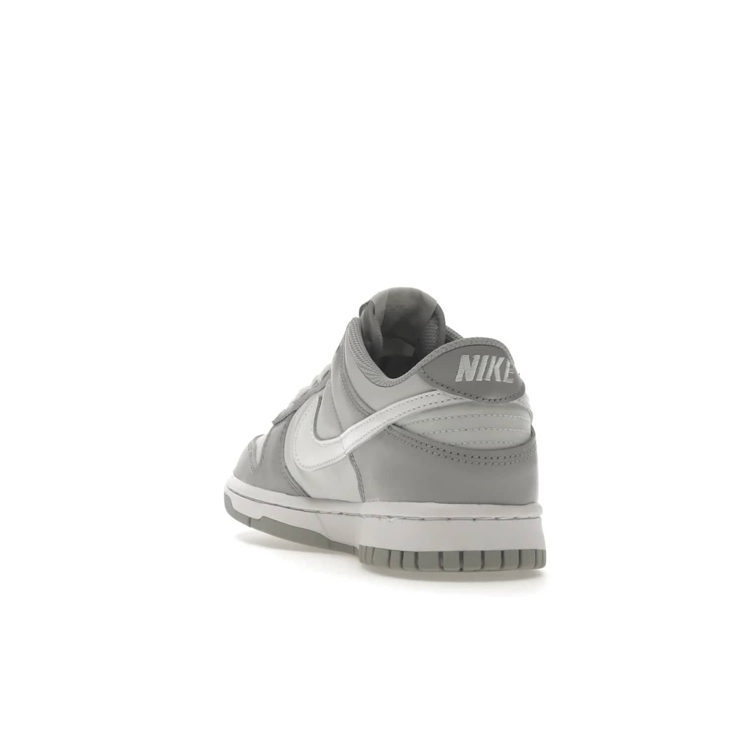 Nike Dunk Low Two-Toned Grey (GS) - Image 26 - Only at www.BallersClubKickz.com - Stylish Nike Dunk Low GS Two-Toned Grey featuring leather build, light/dark grey shades, white Swoosh logo & gray rubber outsole. Get ready to make a statement with this timeless classic released in March 2022.