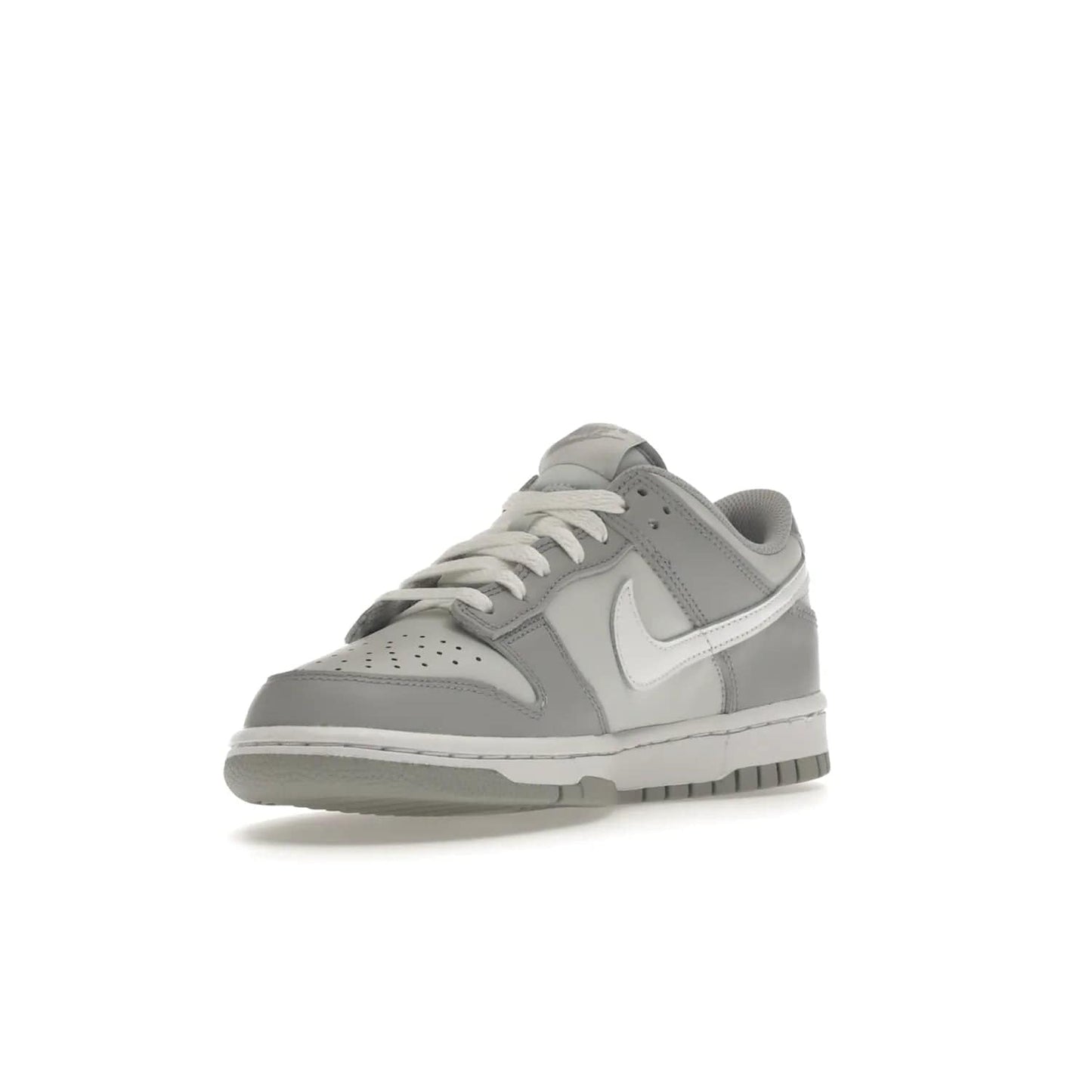 Nike Dunk Low Two-Toned Grey (GS) - Image 14 - Only at www.BallersClubKickz.com - Stylish Nike Dunk Low GS Two-Toned Grey featuring leather build, light/dark grey shades, white Swoosh logo & gray rubber outsole. Get ready to make a statement with this timeless classic released in March 2022.