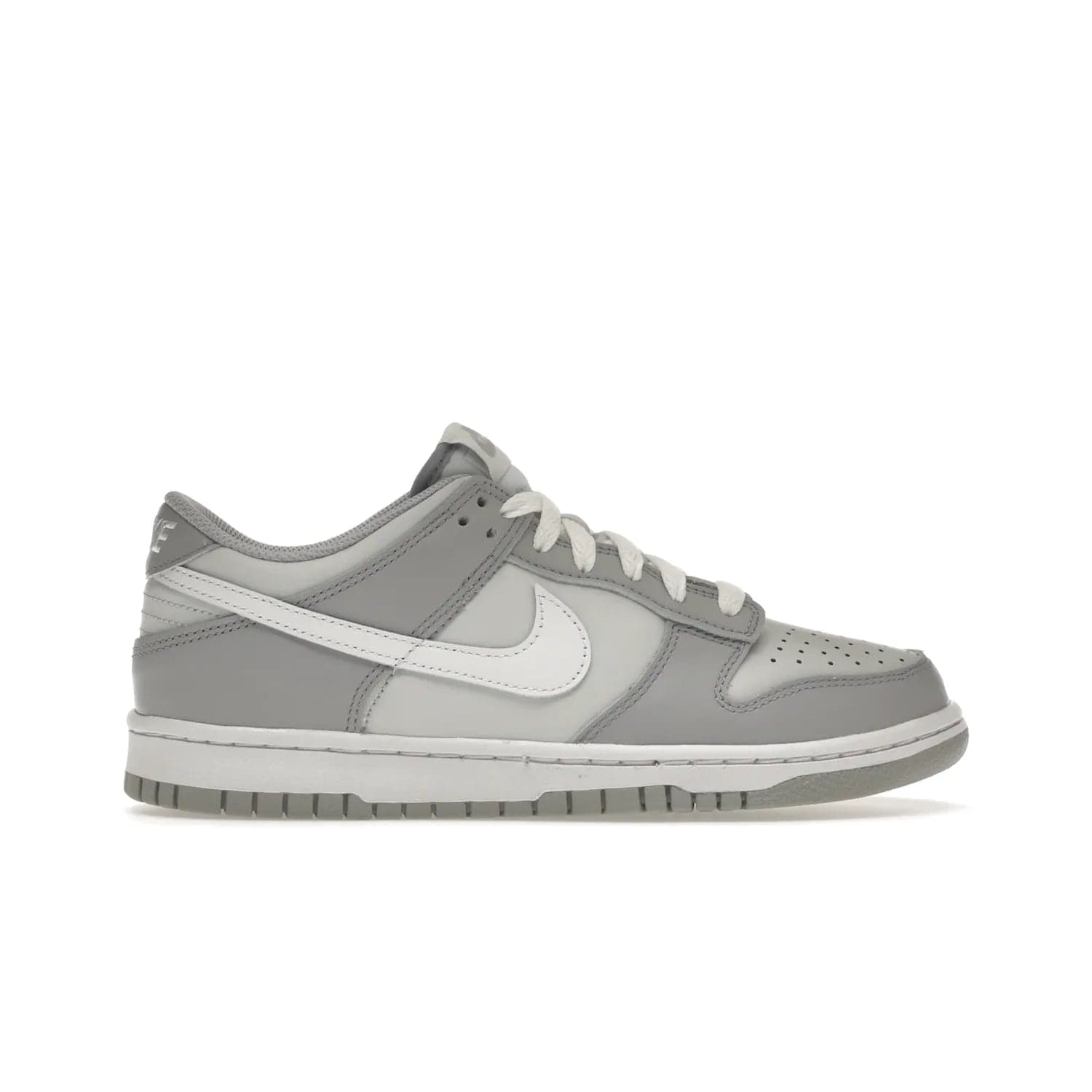 Nike Dunk Low Two-Toned Grey (GS) - Image 1 - Only at www.BallersClubKickz.com - Stylish Nike Dunk Low GS Two-Toned Grey featuring leather build, light/dark grey shades, white Swoosh logo & gray rubber outsole. Get ready to make a statement with this timeless classic released in March 2022.
