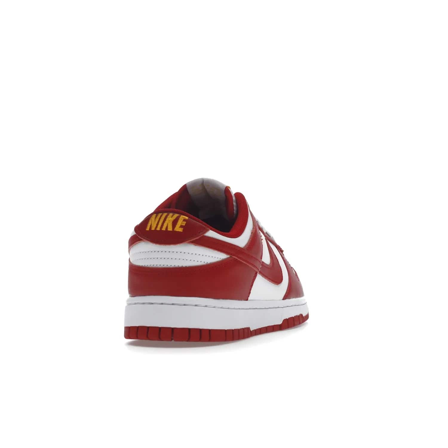 Nike Dunk Low USC - Image 30 - Only at www.BallersClubKickz.com - The Nike Dunk Low USC DD1391-602 colorway captures the eye of University of Southern California fans. Crafted with leather and rubber upper and outsole, this stylish sneaker features a white, gym red, and yellow colorway. With yellow Nike branding, white perforated vamp, and red suede Swoosh, this sneaker turns heads. Get the classic Nike Dunk Low USC releasing on November 9th, 2022.