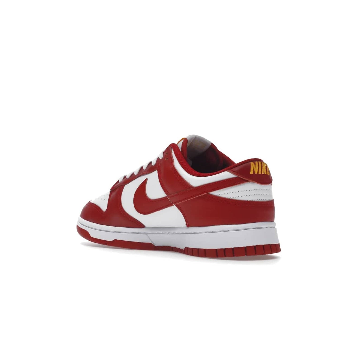 Nike Dunk Low USC - Image 24 - Only at www.BallersClubKickz.com - The Nike Dunk Low USC DD1391-602 colorway captures the eye of University of Southern California fans. Crafted with leather and rubber upper and outsole, this stylish sneaker features a white, gym red, and yellow colorway. With yellow Nike branding, white perforated vamp, and red suede Swoosh, this sneaker turns heads. Get the classic Nike Dunk Low USC releasing on November 9th, 2022.