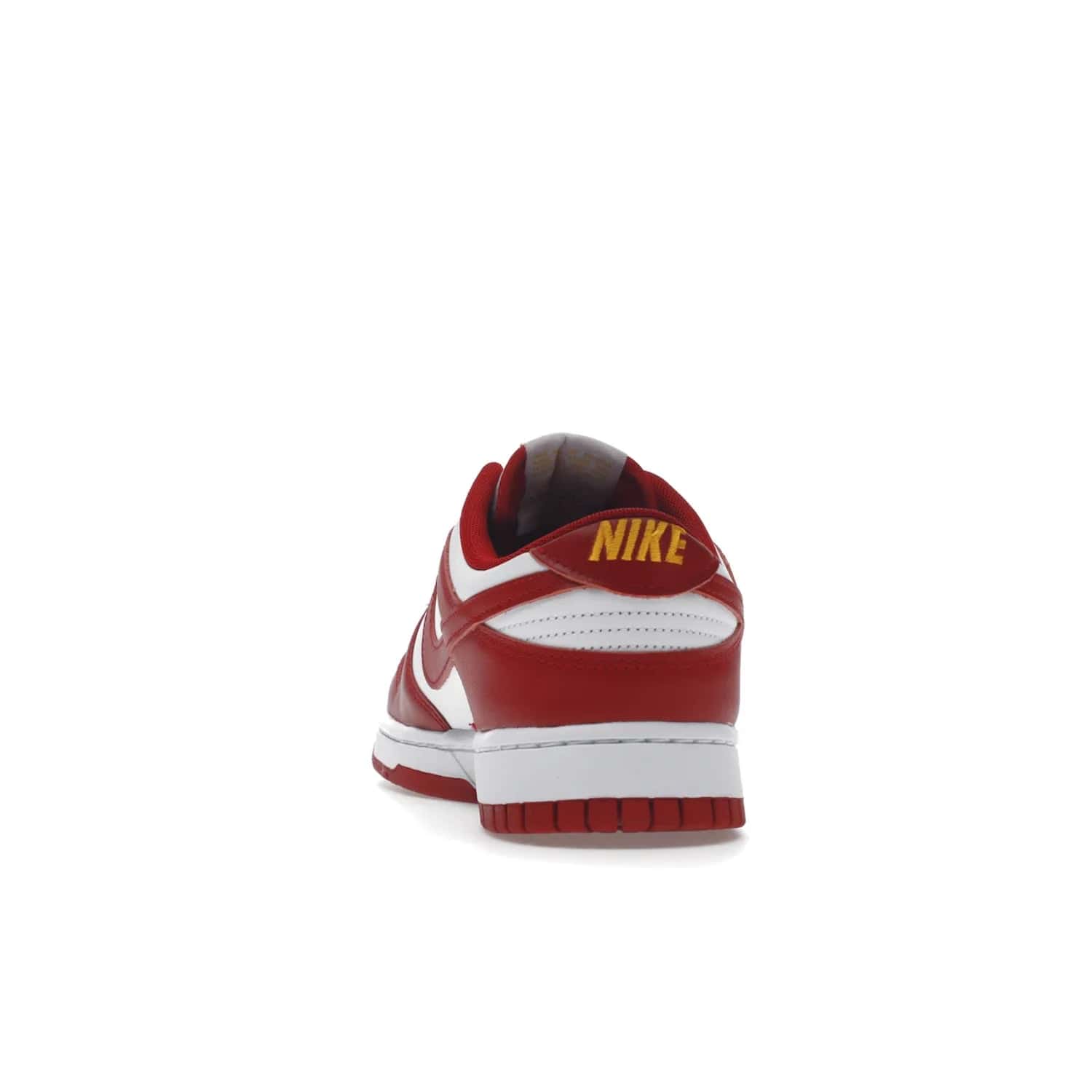 Nike Dunk Low USC - Image 27 - Only at www.BallersClubKickz.com - The Nike Dunk Low USC DD1391-602 colorway captures the eye of University of Southern California fans. Crafted with leather and rubber upper and outsole, this stylish sneaker features a white, gym red, and yellow colorway. With yellow Nike branding, white perforated vamp, and red suede Swoosh, this sneaker turns heads. Get the classic Nike Dunk Low USC releasing on November 9th, 2022.