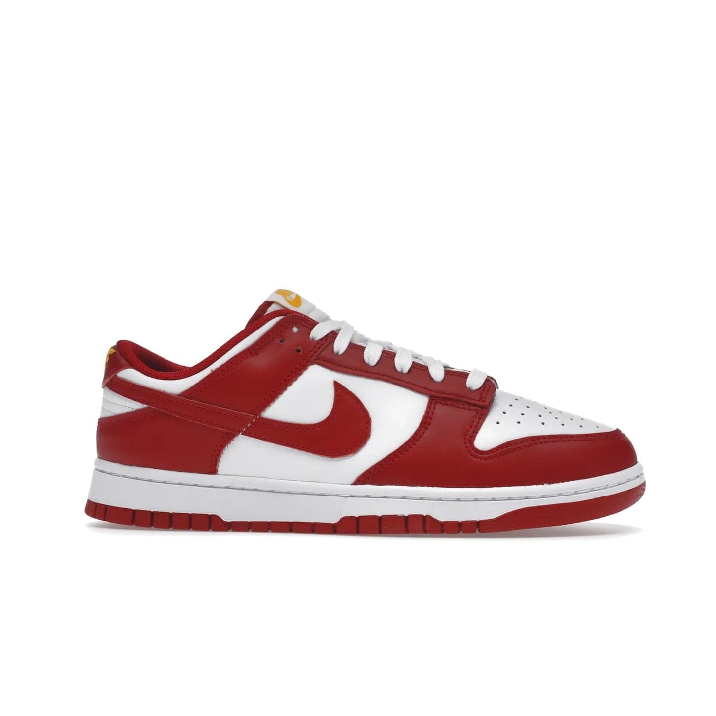 Nike Dunk Low USC - Image 2 - Only at www.BallersClubKickz.com - The Nike Dunk Low USC DD1391-602 colorway captures the eye of University of Southern California fans. Crafted with leather and rubber upper and outsole, this stylish sneaker features a white, gym red, and yellow colorway. With yellow Nike branding, white perforated vamp, and red suede Swoosh, this sneaker turns heads. Get the classic Nike Dunk Low USC releasing on November 9th, 2022.