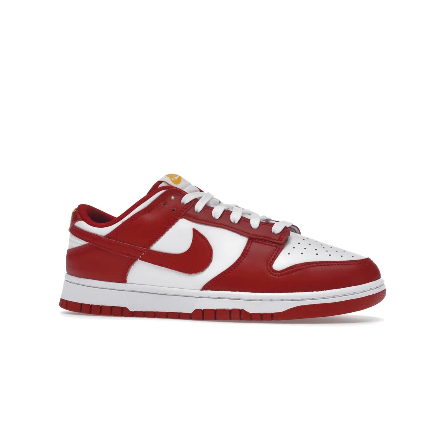 Nike Dunk Low USC - Image 3 - Only at www.BallersClubKickz.com - The Nike Dunk Low USC DD1391-602 colorway captures the eye of University of Southern California fans. Crafted with leather and rubber upper and outsole, this stylish sneaker features a white, gym red, and yellow colorway. With yellow Nike branding, white perforated vamp, and red suede Swoosh, this sneaker turns heads. Get the classic Nike Dunk Low USC releasing on November 9th, 2022.