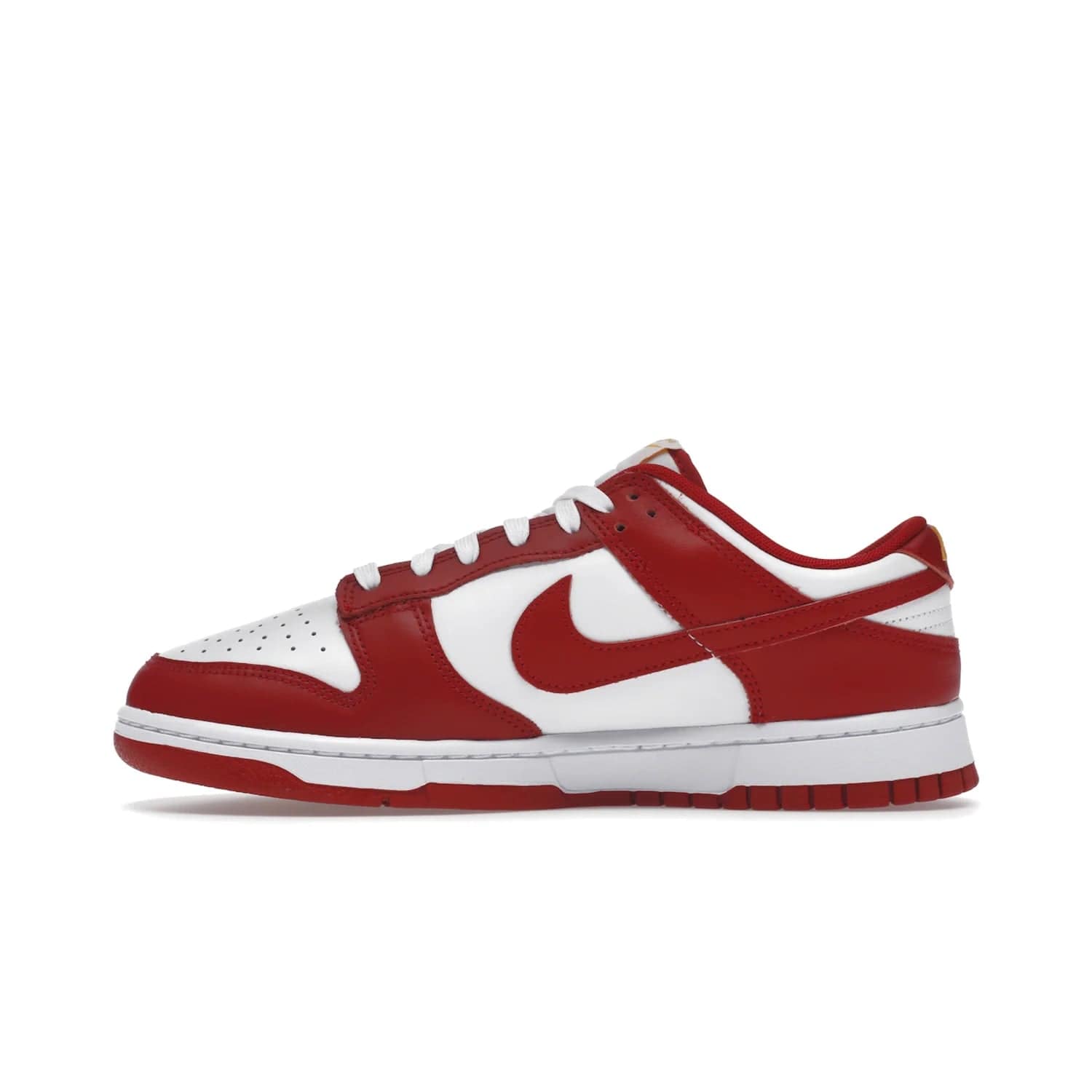 Nike Dunk Low USC - Image 19 - Only at www.BallersClubKickz.com - The Nike Dunk Low USC DD1391-602 colorway captures the eye of University of Southern California fans. Crafted with leather and rubber upper and outsole, this stylish sneaker features a white, gym red, and yellow colorway. With yellow Nike branding, white perforated vamp, and red suede Swoosh, this sneaker turns heads. Get the classic Nike Dunk Low USC releasing on November 9th, 2022.