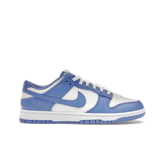Nike Dunk Low Polar Blue - Image 1 - Only at www.BallersClubKickz.com - The Nike Dunk Low in Polar Blue combines streetwear and basketball style with leather uppers and white and Polar Blue overlays. Features include a rubber outsole, Nike Swoosh, white branding, and a padded tongue. Perfect for sports, casual, or everyday wear. On sale October 14th, 2023.