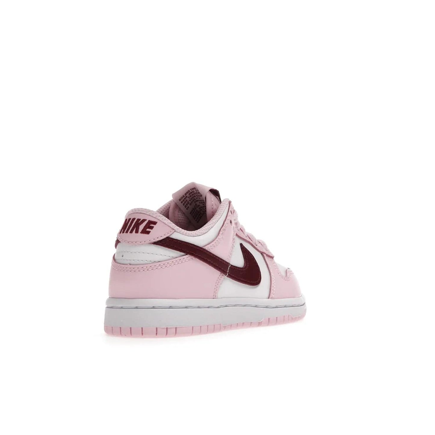 Nike Dunk Low Pink Red White (PS) - Image 31 - Only at www.BallersClubKickz.com - Introducing the Nike Dunk Low Pink Red White (PS), the perfect addition to your sneaker collection. A classic silhouette with modern vibrant colors, including a pink upper with red and white accents and a white midsole. Comfort and durability, perfect for any outfit. Limited edition, available June 22nd.