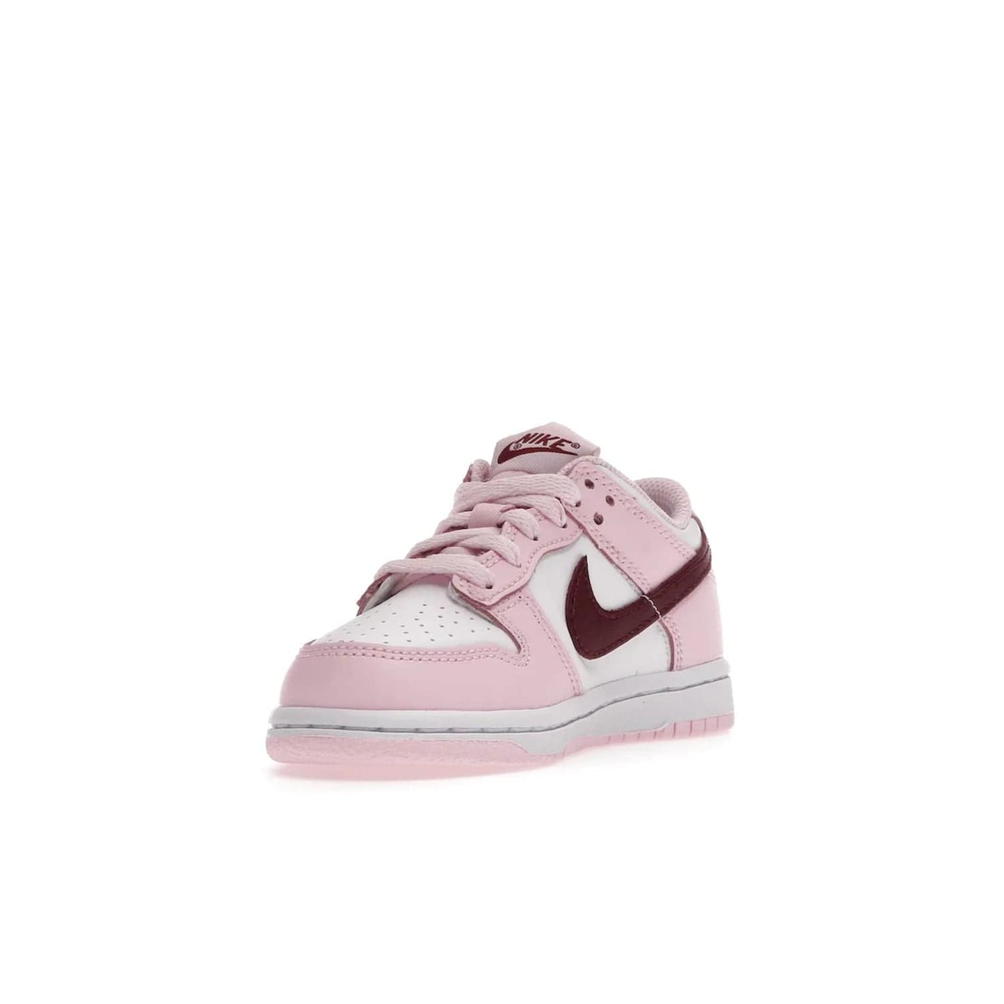 Nike Dunk Low Pink Red White (PS) - Image 13 - Only at www.BallersClubKickz.com - Introducing the Nike Dunk Low Pink Red White (PS), the perfect addition to your sneaker collection. A classic silhouette with modern vibrant colors, including a pink upper with red and white accents and a white midsole. Comfort and durability, perfect for any outfit. Limited edition, available June 22nd.