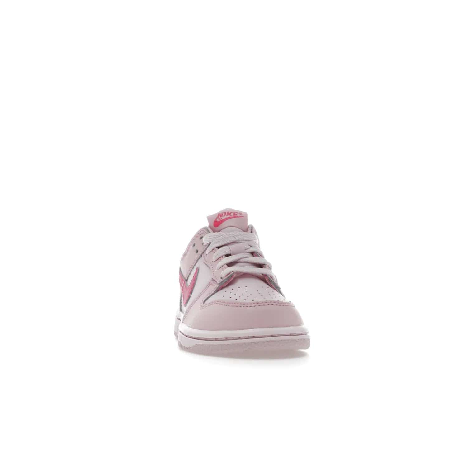 Nike Dunk Low Triple Pink (PS) - Image 9 - Only at www.BallersClubKickz.com - A stunning shoe option for completing any look: Nike Dunk Low Triple Pink (Preschool). Light pink layered leather upper with darker pink synthetic accents. Plus toe box of perforated pink leather and Nike symbol embroidered pull tab. Rubber midsole and outsole. Affordable price of $85.