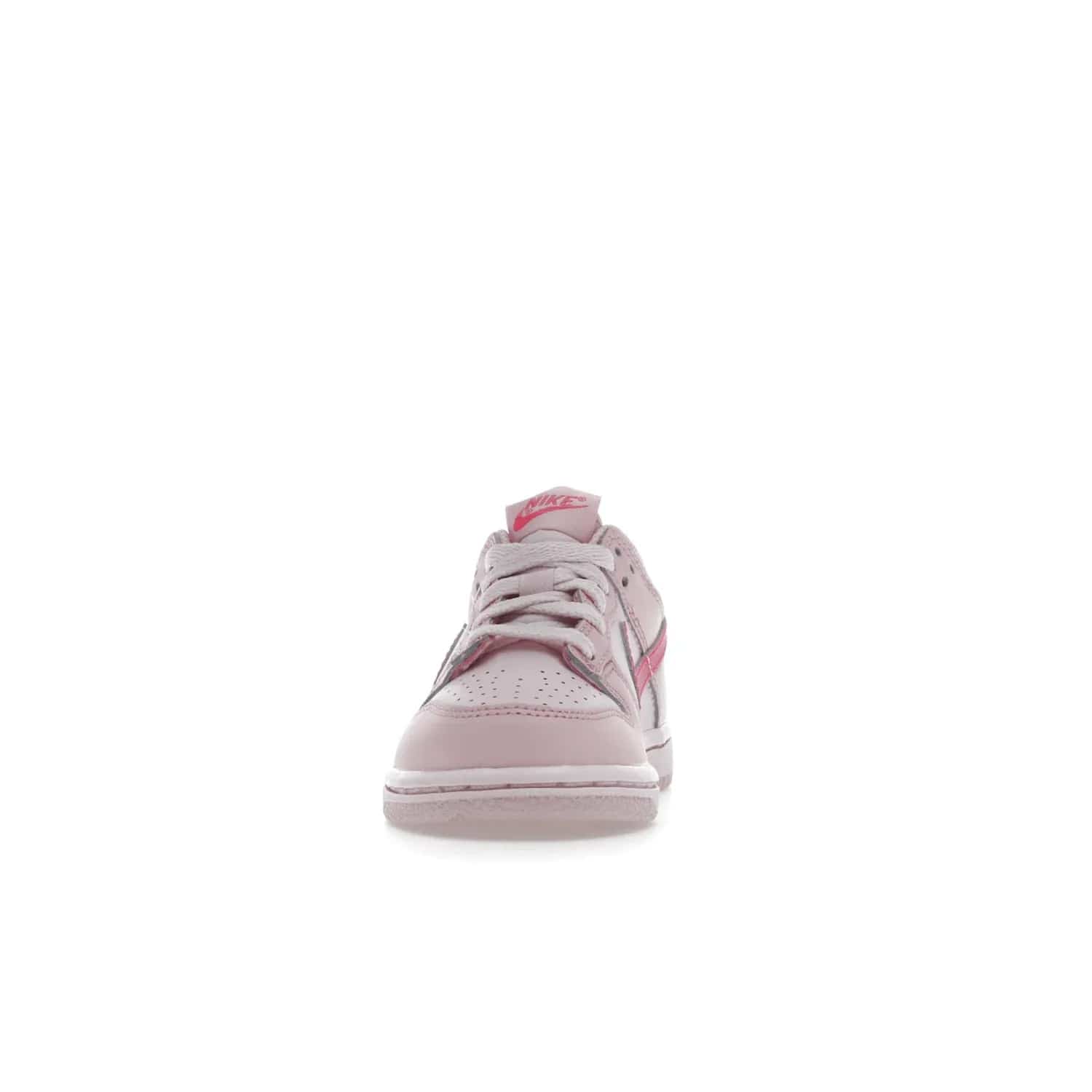 Nike Dunk Low Triple Pink (PS) - Image 11 - Only at www.BallersClubKickz.com - A stunning shoe option for completing any look: Nike Dunk Low Triple Pink (Preschool). Light pink layered leather upper with darker pink synthetic accents. Plus toe box of perforated pink leather and Nike symbol embroidered pull tab. Rubber midsole and outsole. Affordable price of $85.