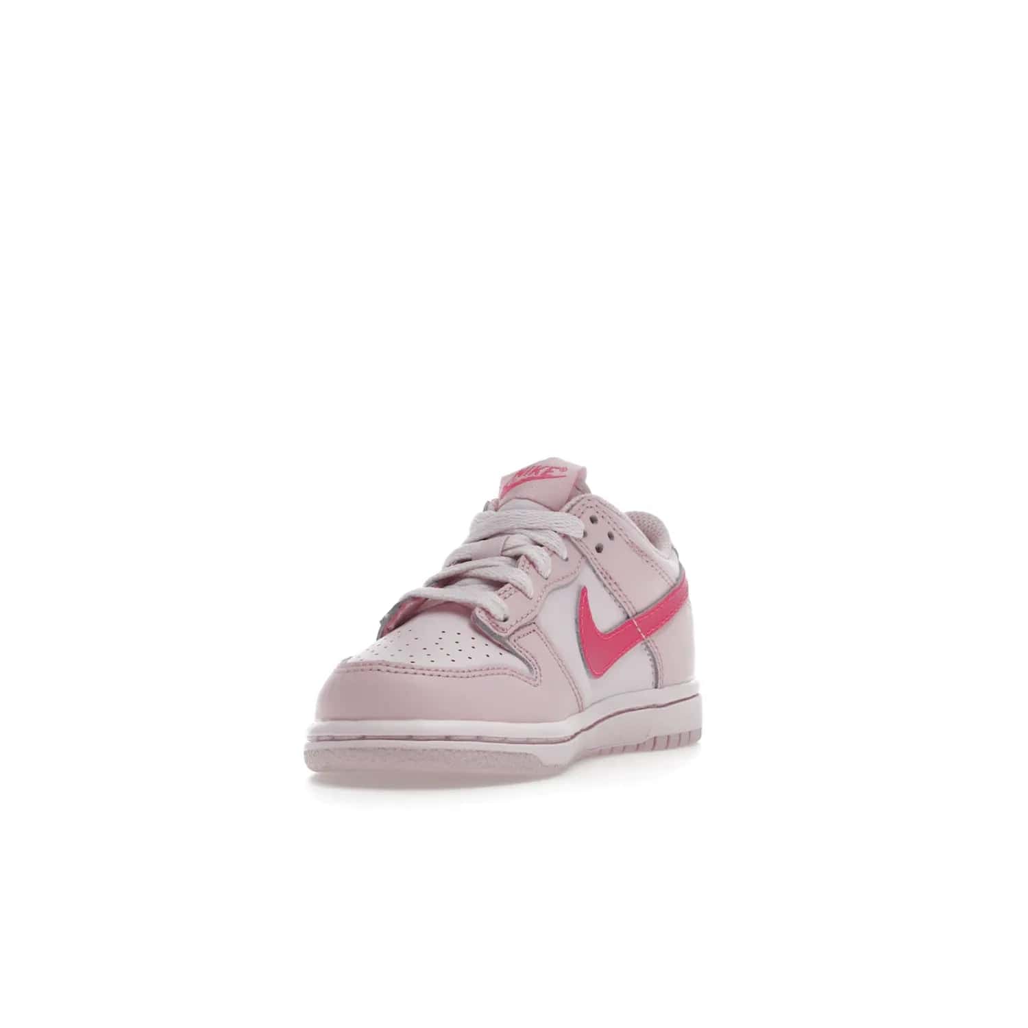 Nike Dunk Low Triple Pink (PS) - Image 13 - Only at www.BallersClubKickz.com - A stunning shoe option for completing any look: Nike Dunk Low Triple Pink (Preschool). Light pink layered leather upper with darker pink synthetic accents. Plus toe box of perforated pink leather and Nike symbol embroidered pull tab. Rubber midsole and outsole. Affordable price of $85.