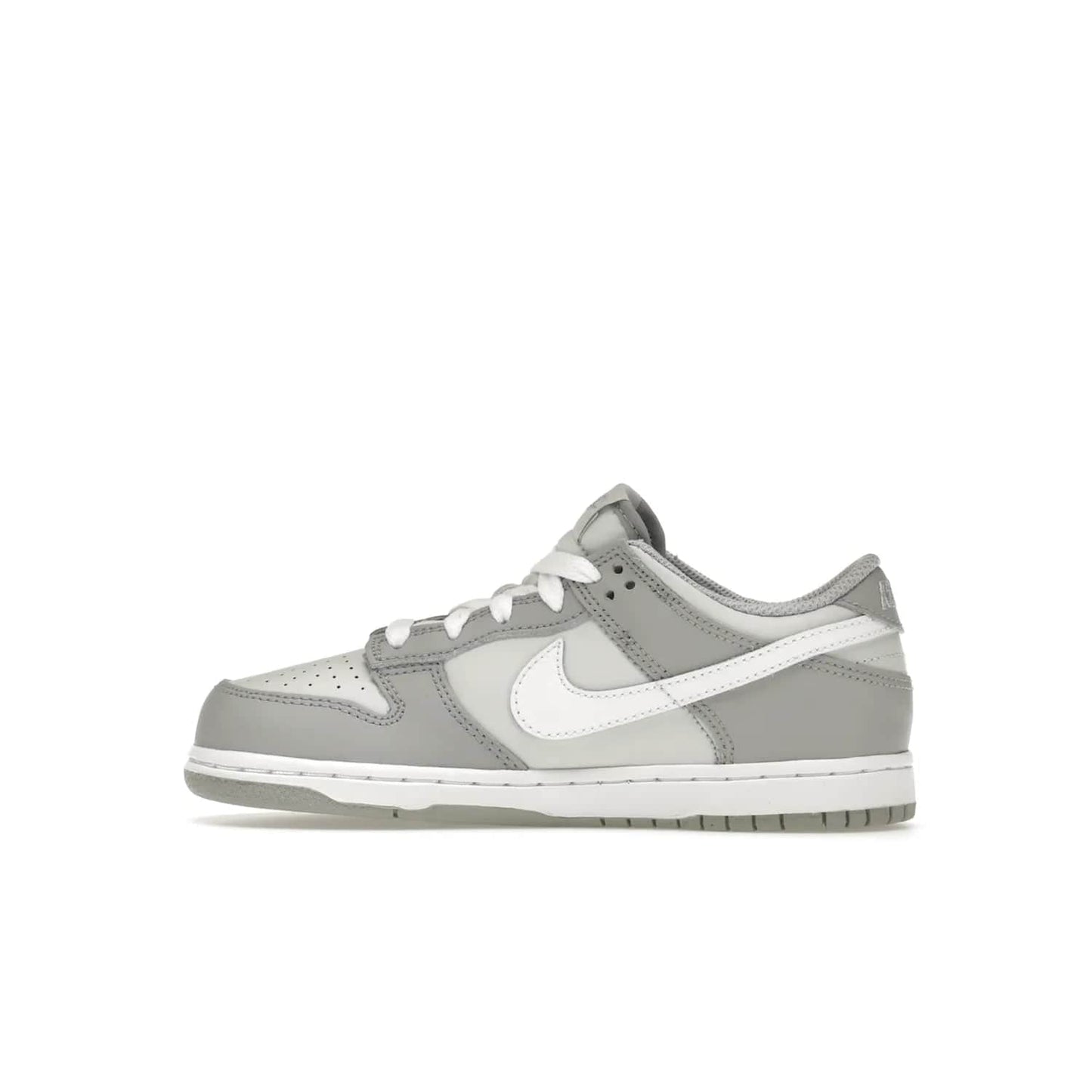 Nike Dunk Low Two-Toned Grey (PS) - Image 20 - Only at www.BallersClubKickz.com - Classic Nike style for your little one with the Nike Dunk Low Two-Toned Grey (Preschool). White laces, white tongue, white leather swoosh, grey sole & midsole, and patches of grey leather are timeless classics. Released March 2022 for comfort & style.