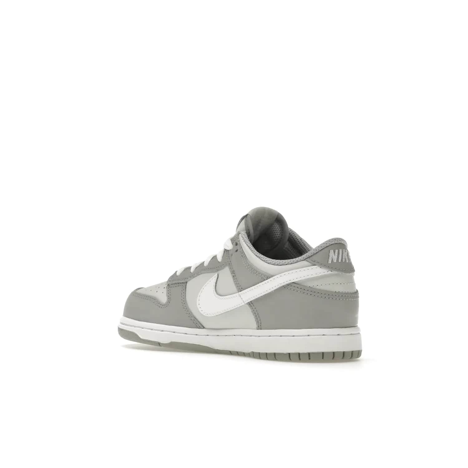 Nike Dunk Low Two-Toned Grey (PS) - Image 24 - Only at www.BallersClubKickz.com - Classic Nike style for your little one with the Nike Dunk Low Two-Toned Grey (Preschool). White laces, white tongue, white leather swoosh, grey sole & midsole, and patches of grey leather are timeless classics. Released March 2022 for comfort & style.