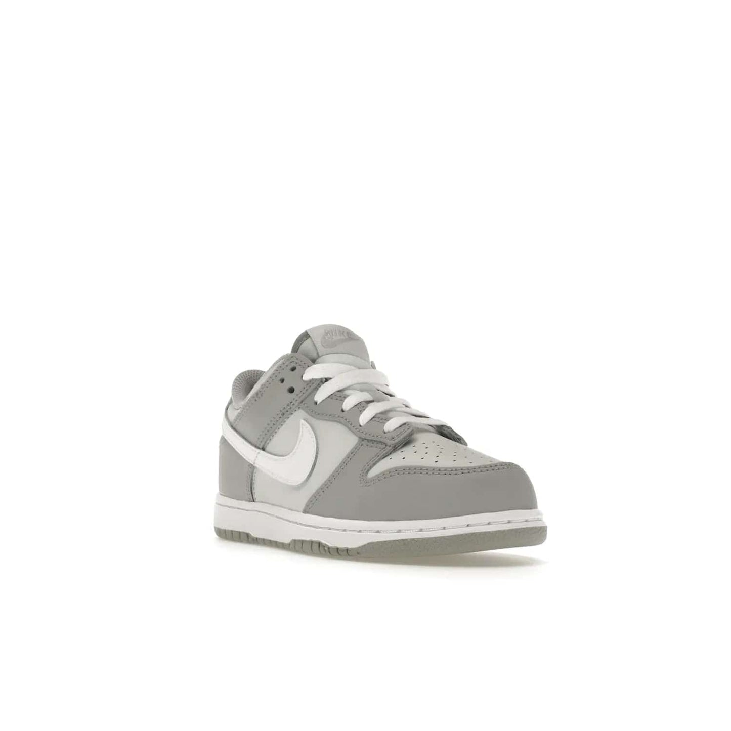 Nike Dunk Low Two-Toned Grey (PS) - Image 7 - Only at www.BallersClubKickz.com - Classic Nike style for your little one with the Nike Dunk Low Two-Toned Grey (Preschool). White laces, white tongue, white leather swoosh, grey sole & midsole, and patches of grey leather are timeless classics. Released March 2022 for comfort & style.