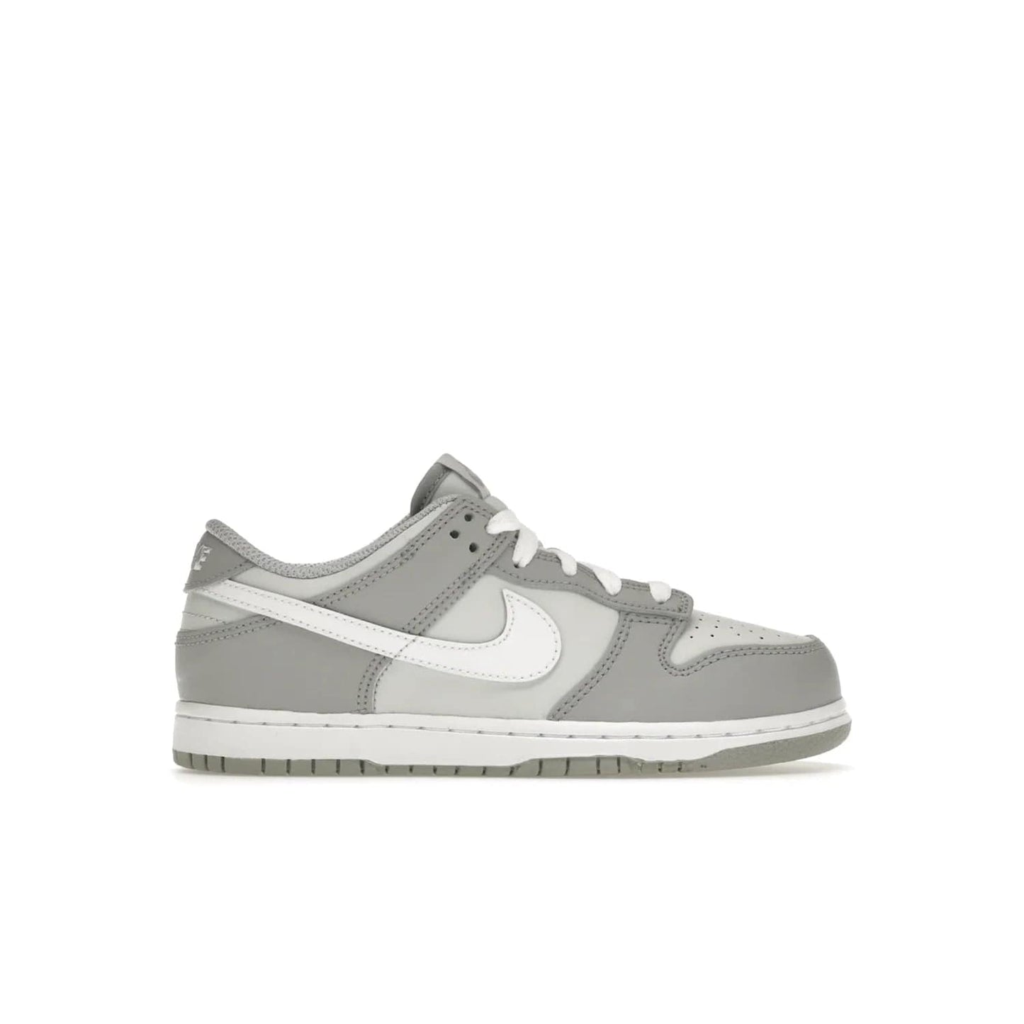Nike Dunk Low Two-Toned Grey (PS) - Image 1 - Only at www.BallersClubKickz.com - Classic Nike style for your little one with the Nike Dunk Low Two-Toned Grey (Preschool). White laces, white tongue, white leather swoosh, grey sole & midsole, and patches of grey leather are timeless classics. Released March 2022 for comfort & style.