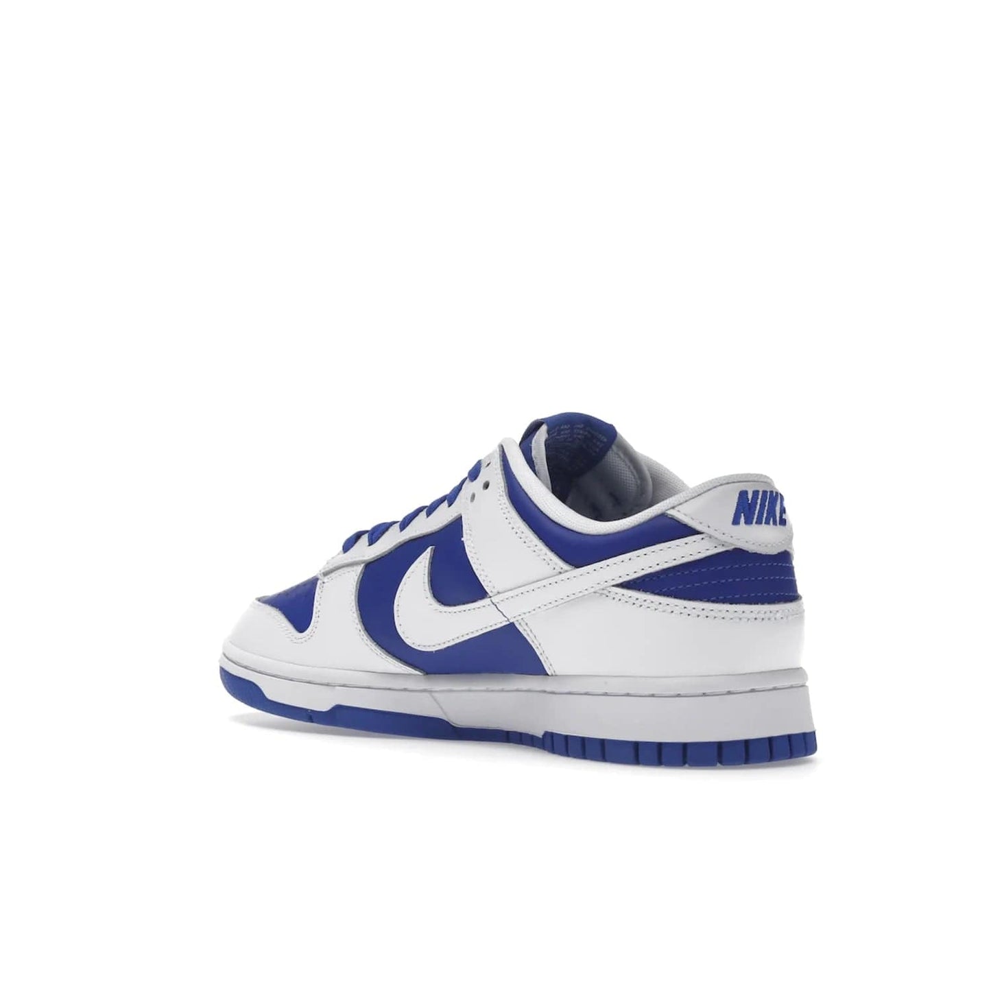 Nike Dunk Low Racer Blue White - Image 24 - Only at www.BallersClubKickz.com - Sleek Racer Blue leather upper and white leather overlays make up the Nike Dunk Low Racer Blue White. Woven tag and heel embroidery for a 1985 Dunk look with a matching EVA foam sole completes the classic colorway.