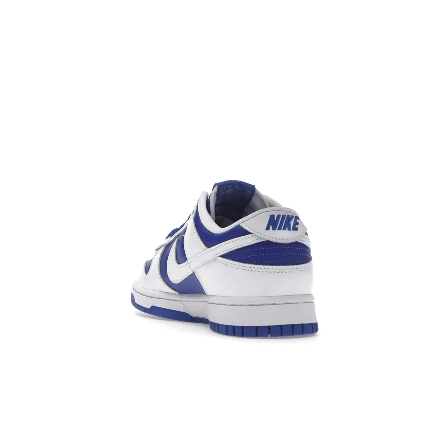 Nike Dunk Low Racer Blue White - Image 26 - Only at www.BallersClubKickz.com - Sleek Racer Blue leather upper and white leather overlays make up the Nike Dunk Low Racer Blue White. Woven tag and heel embroidery for a 1985 Dunk look with a matching EVA foam sole completes the classic colorway.