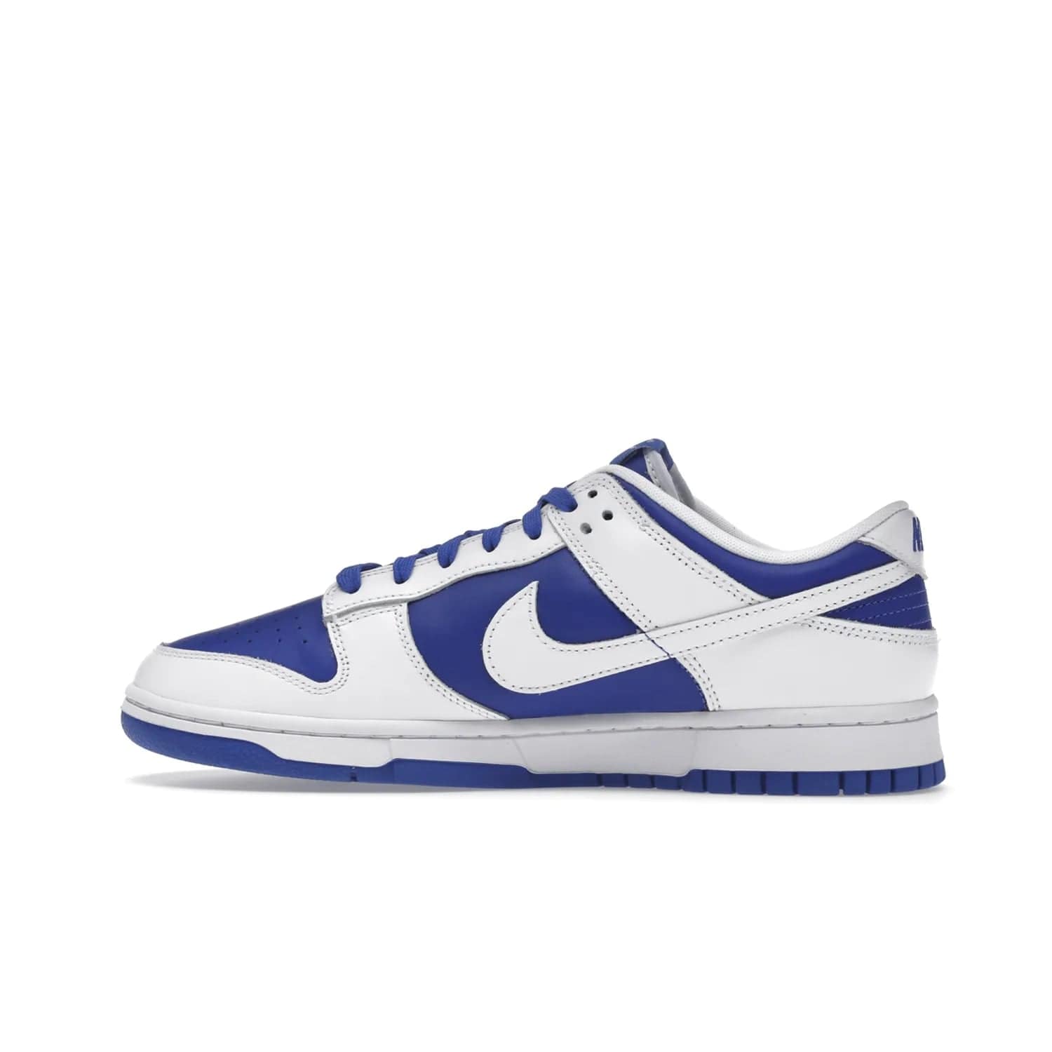 Nike Dunk Low Racer Blue White - Image 20 - Only at www.BallersClubKickz.com - Sleek Racer Blue leather upper and white leather overlays make up the Nike Dunk Low Racer Blue White. Woven tag and heel embroidery for a 1985 Dunk look with a matching EVA foam sole completes the classic colorway.